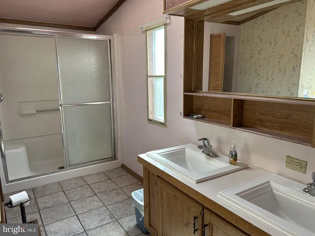 a view of a room with a fireplace and a shower