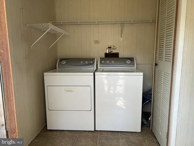 a bathroom with a shower and a bath tub