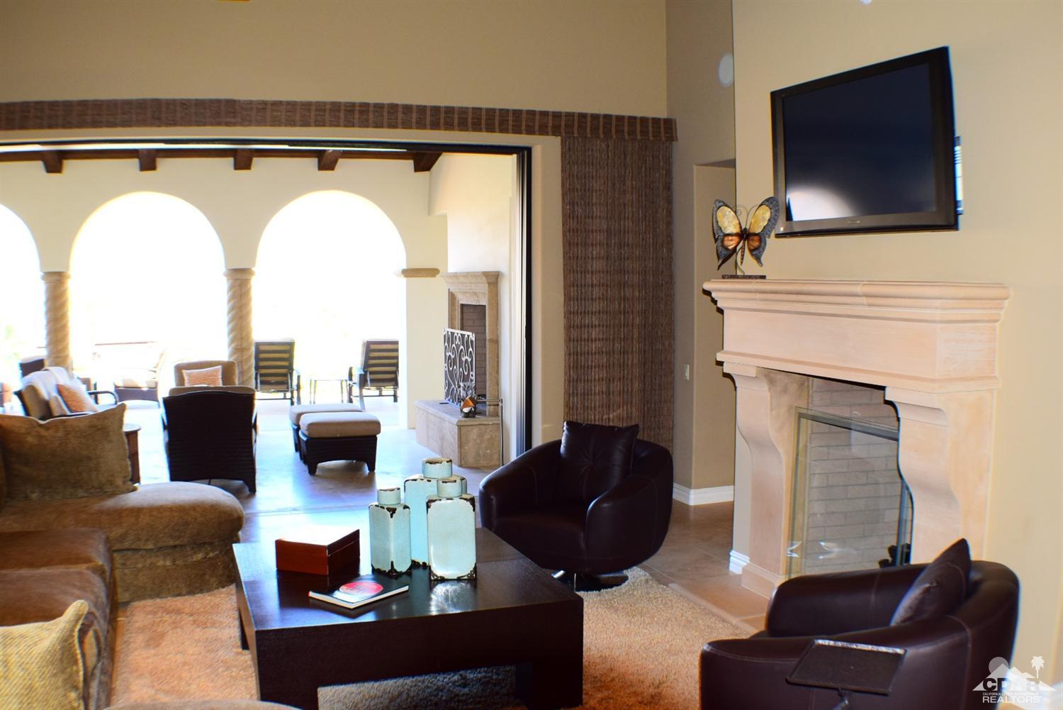 9 Santa Rosa Mountain Lane Rancho Mirage, CA 92270 - Photo 11 of 58 a living room with furniture and a flat screen tv