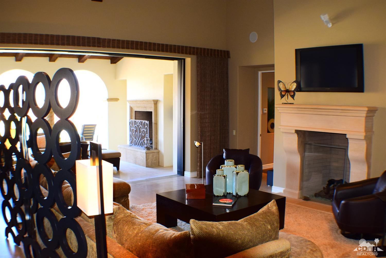 9 Santa Rosa Mountain Lane Rancho Mirage, CA 92270 - Photo 14 of 58 a living room with furniture and a flat screen tv