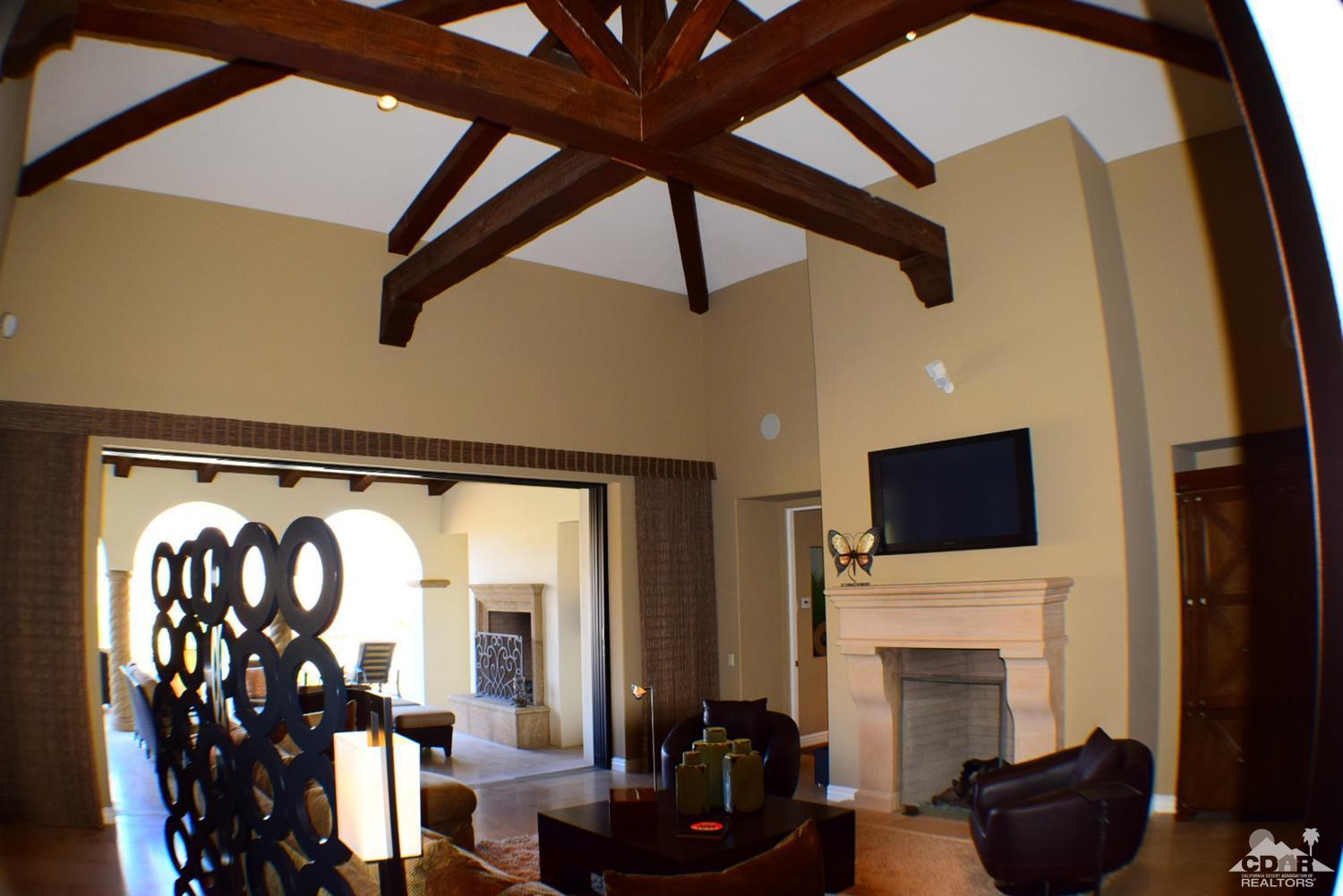 9 Santa Rosa Mountain Lane Rancho Mirage, CA 92270 - Photo 15 of 58 a living room with furniture and a fireplace