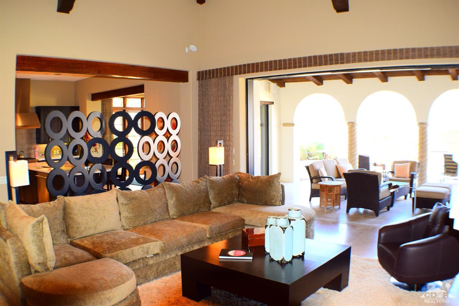 9 Santa Rosa Mountain Lane Rancho Mirage, CA 92270 - Photo 16 of 58 a living room with furniture and a large window