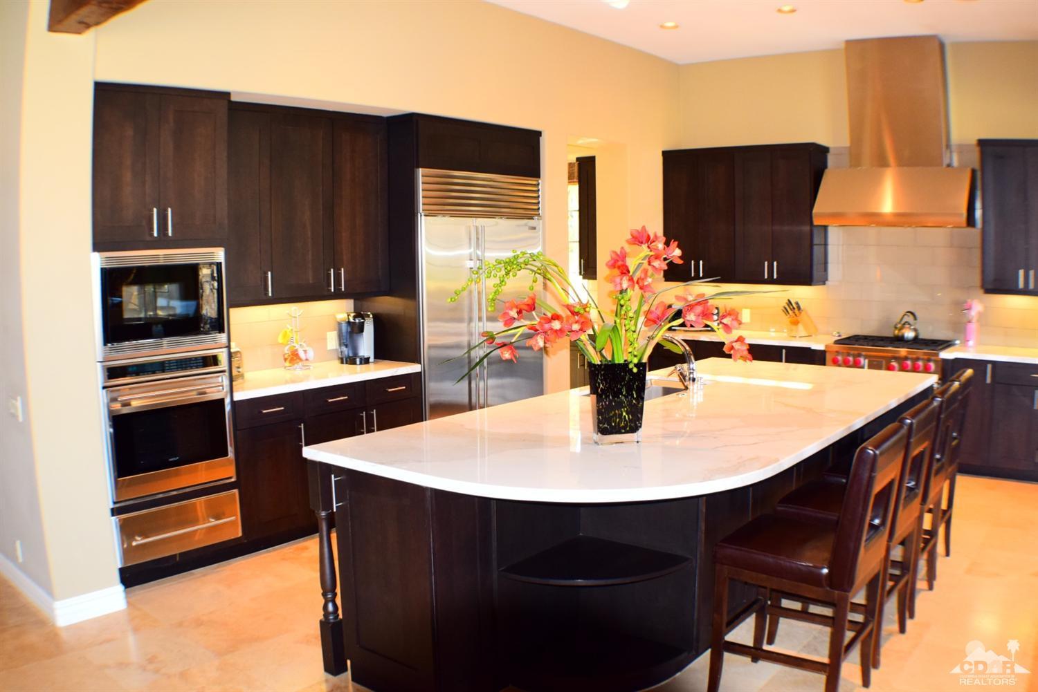 9 Santa Rosa Mountain Lane Rancho Mirage, CA 92270 - Photo 20 of 58 a kitchen with stainless steel appliances a sink stove and refrigerator