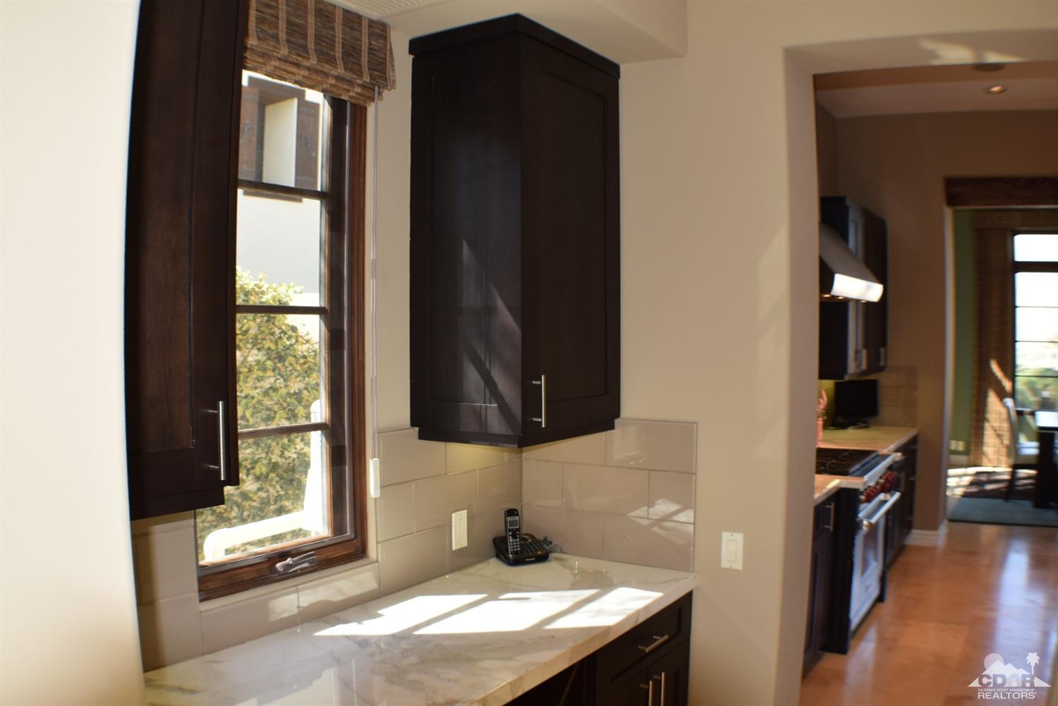 9 Santa Rosa Mountain Lane Rancho Mirage, CA 92270 - Photo 24 of 58 a bathroom with a sink and a mirror