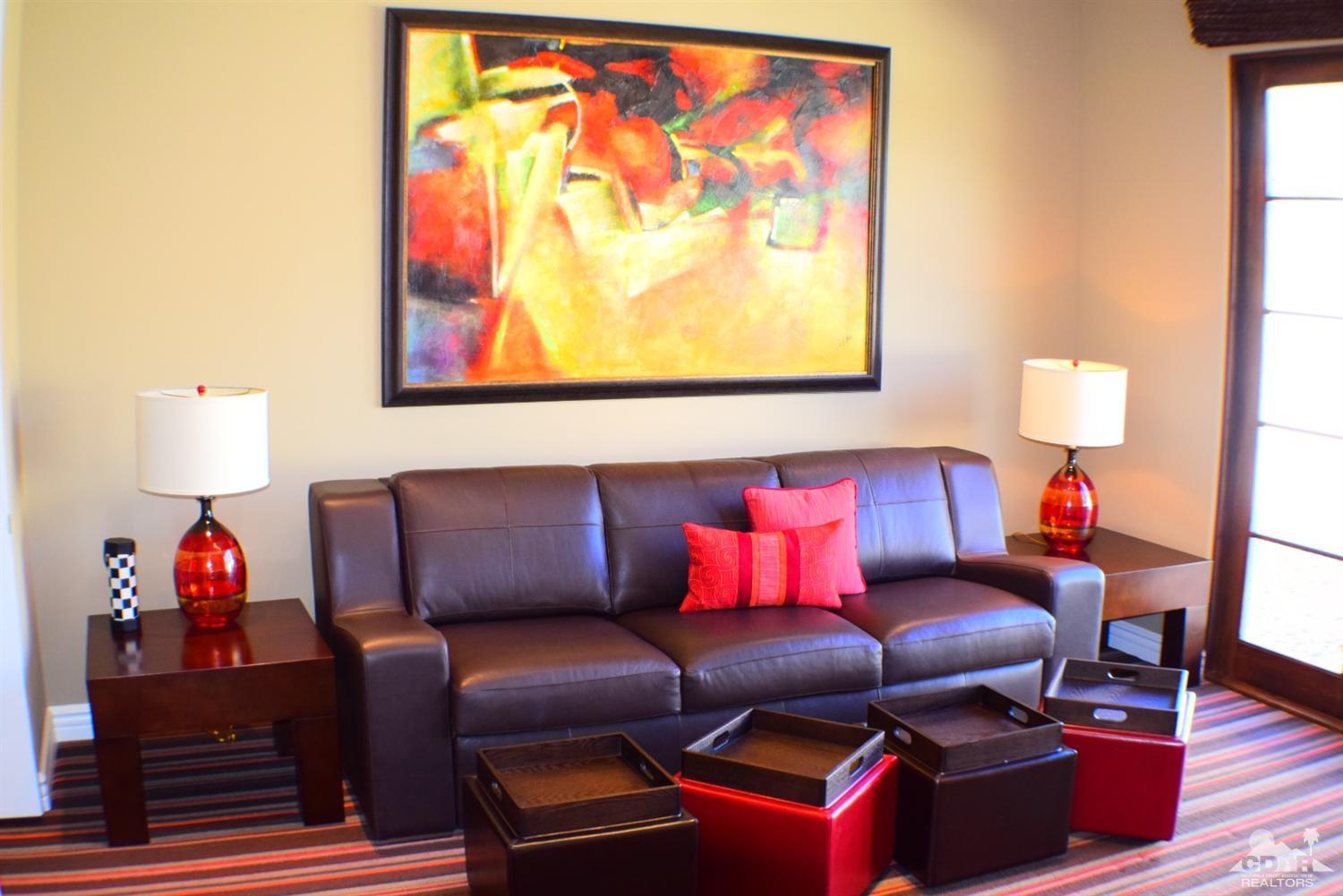 9 Santa Rosa Mountain Lane Rancho Mirage, CA 92270 - Photo 30 of 58 a living room with furniture and a lamp