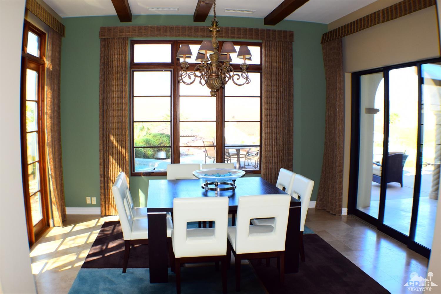 9 Santa Rosa Mountain Lane Rancho Mirage, CA 92270 - Photo 38 of 58 a view of a dining room with furniture window and wooden floor