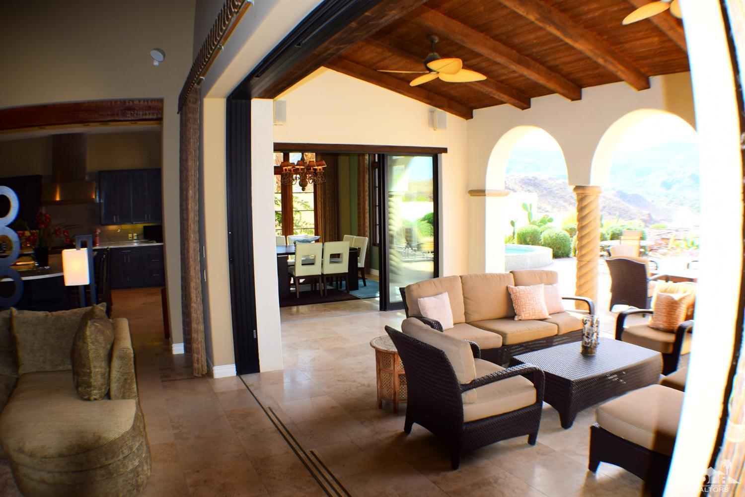 9 Santa Rosa Mountain Lane Rancho Mirage, CA 92270 - Photo 46 of 58 a living room with furniture and a large window