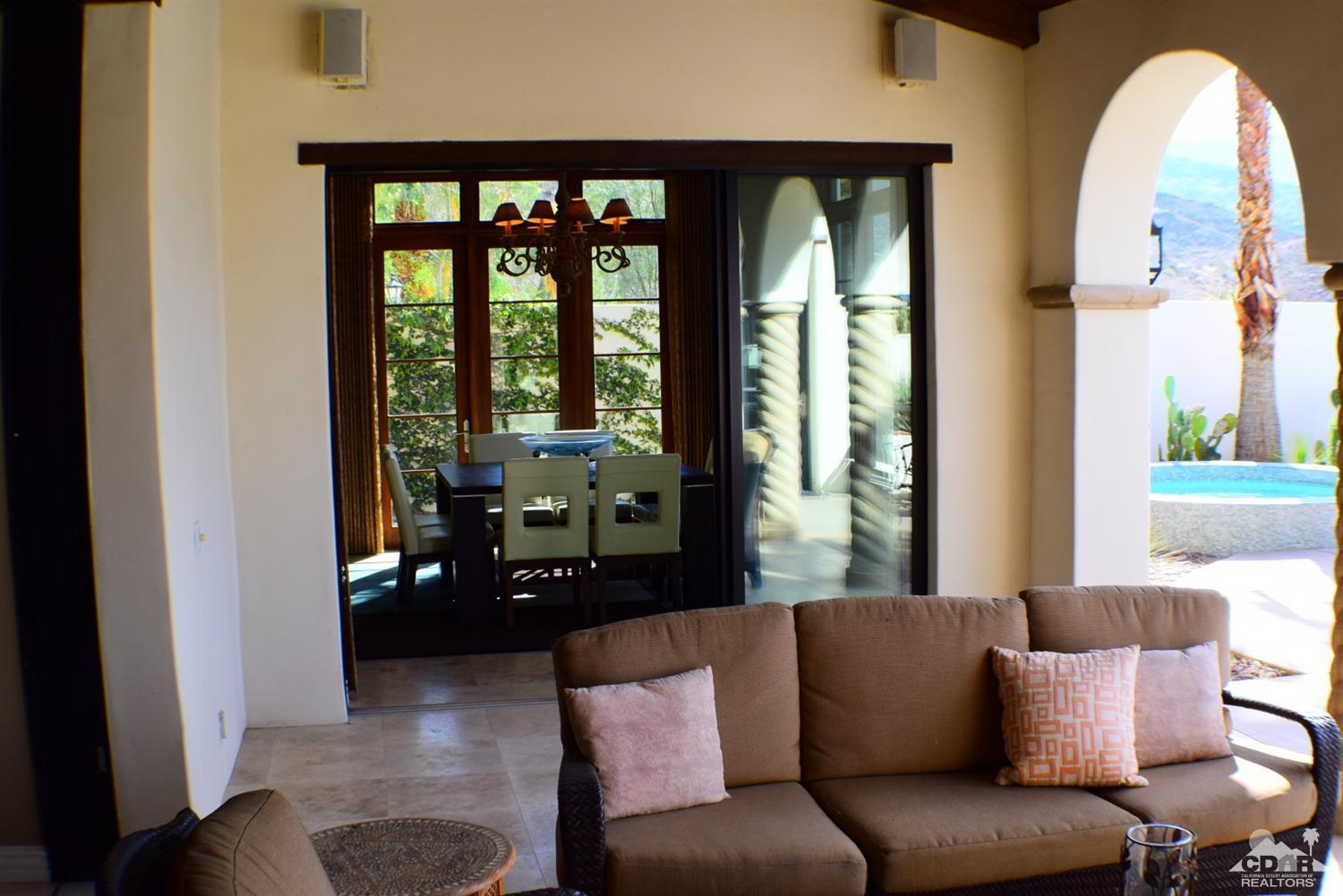 9 Santa Rosa Mountain Lane Rancho Mirage, CA 92270 - Photo 47 of 58 a living room with furniture and a large window