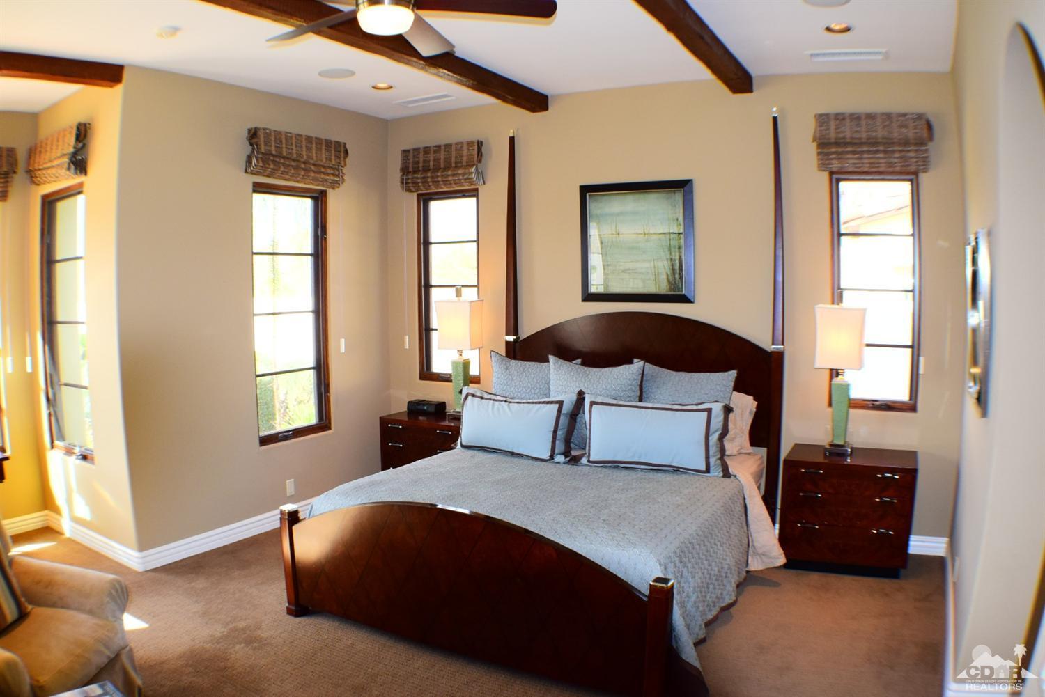 9 Santa Rosa Mountain Lane Rancho Mirage, CA 92270 - Photo 49 of 58 a bedroom with a large bed and a window