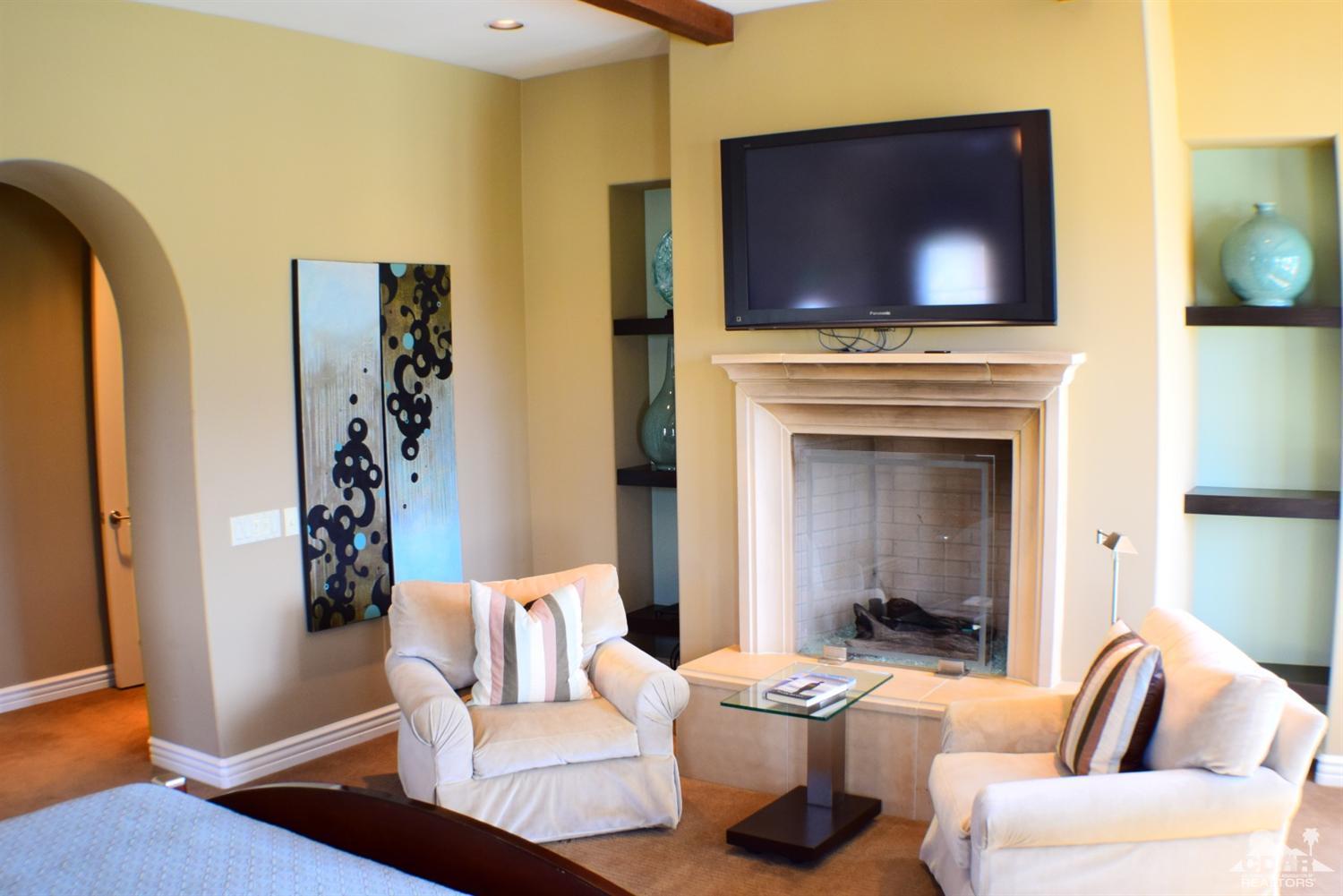 9 Santa Rosa Mountain Lane Rancho Mirage, CA 92270 - Photo 51 of 58 a living room with furniture and a flat screen tv