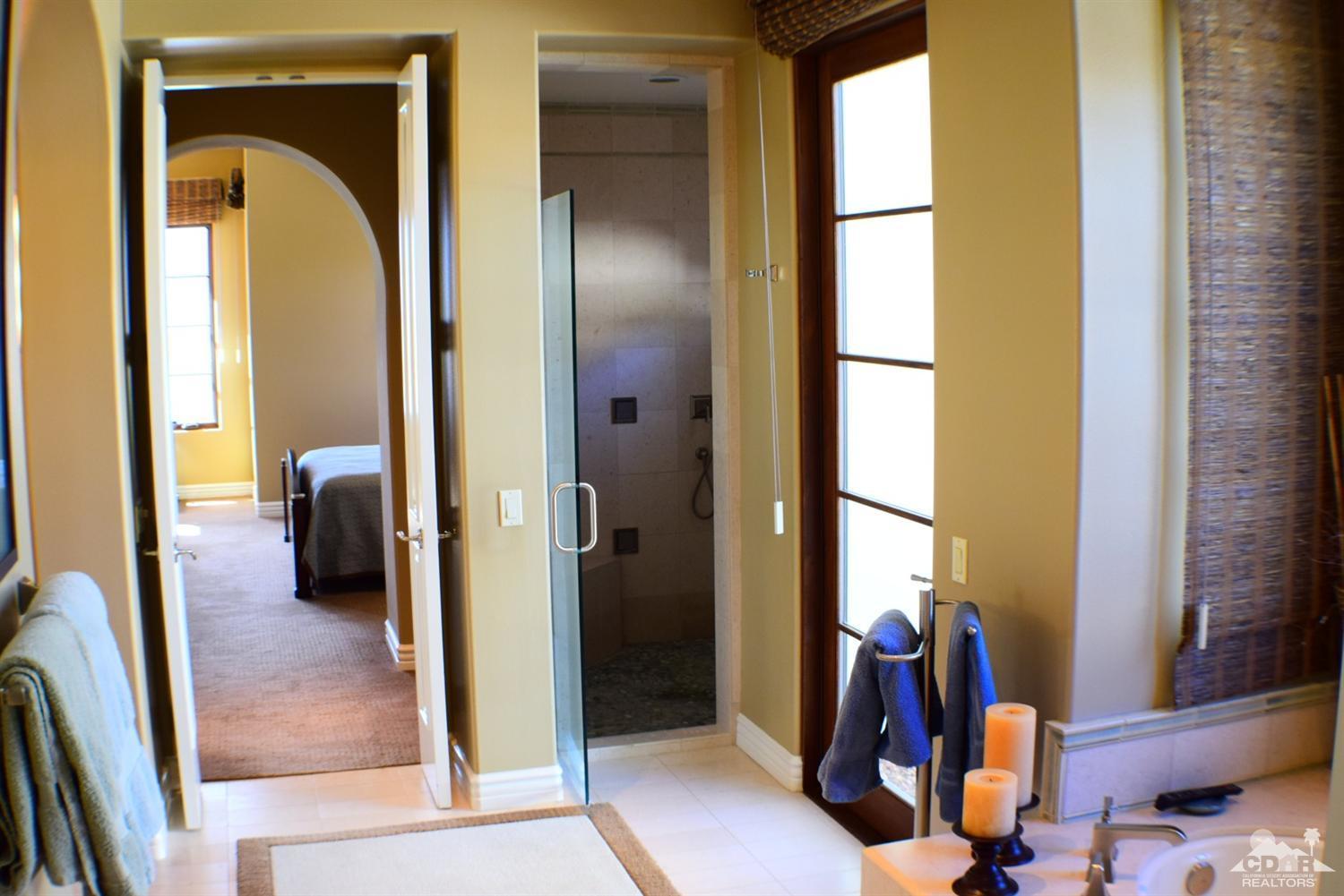 9 Santa Rosa Mountain Lane Rancho Mirage, CA 92270 - Photo 55 of 58 a view of a hallway with furniture and a window
