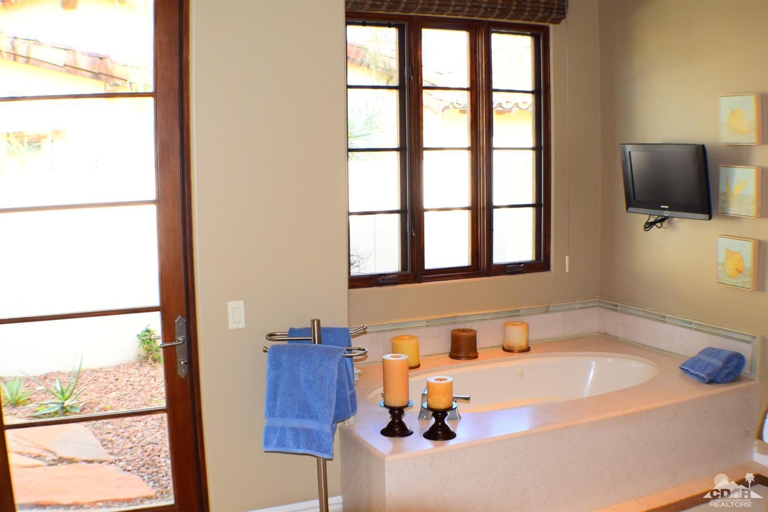 9 Santa Rosa Mountain Lane Rancho Mirage, CA 92270 - Photo 57 of 58 a bathroom with a tub and a sink
