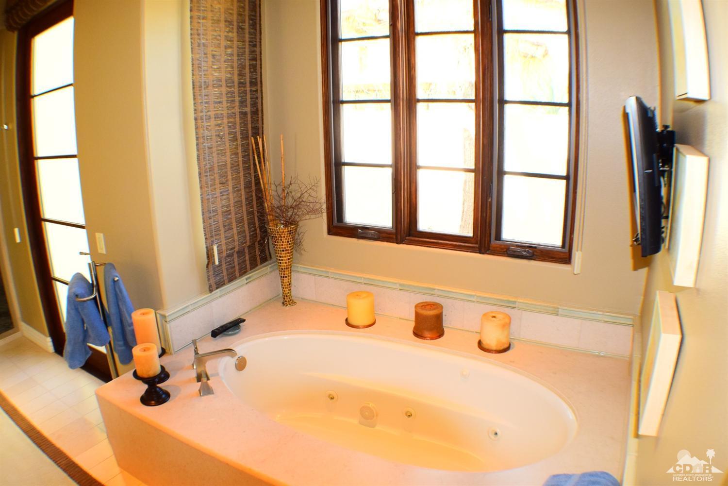 9 Santa Rosa Mountain Lane Rancho Mirage, CA 92270 - Photo 58 of 58 a bathroom with a tub sink and a window