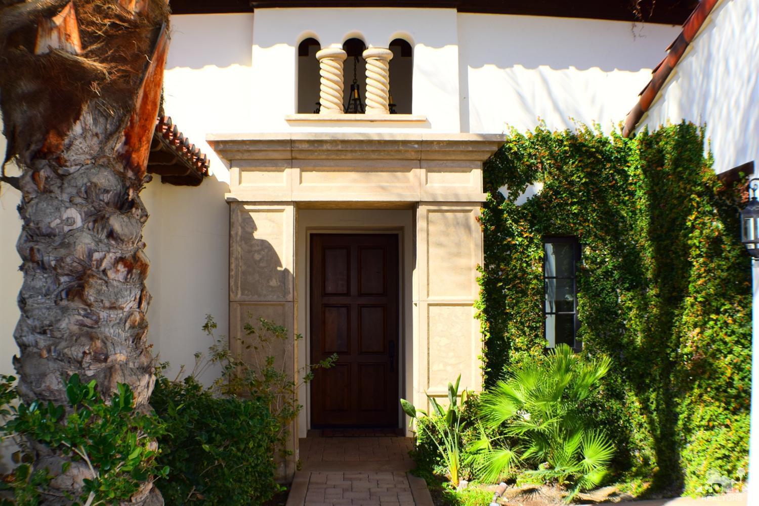 9 Santa Rosa Mountain Lane Rancho Mirage, CA 92270 - Photo 9 of 58 a front view of a house with garden