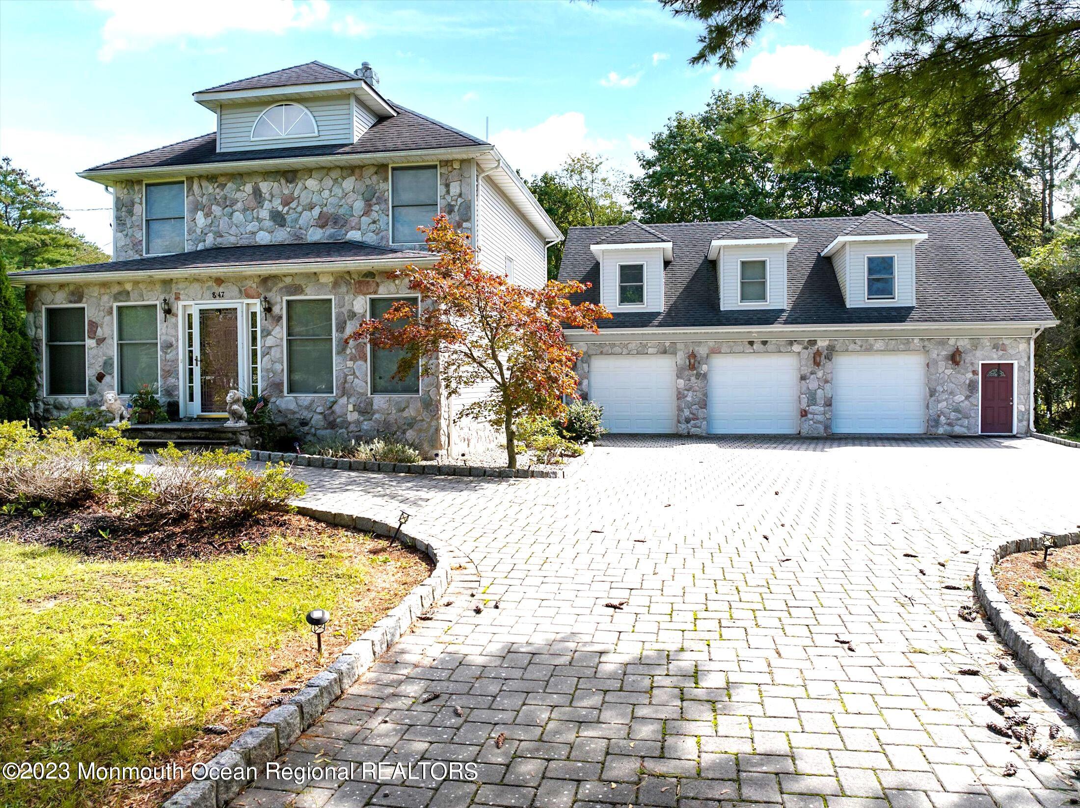 847 Waterworks Road Freehold, NJ 07728 - Photo 1 of 74 front view of a house with a swimming pool