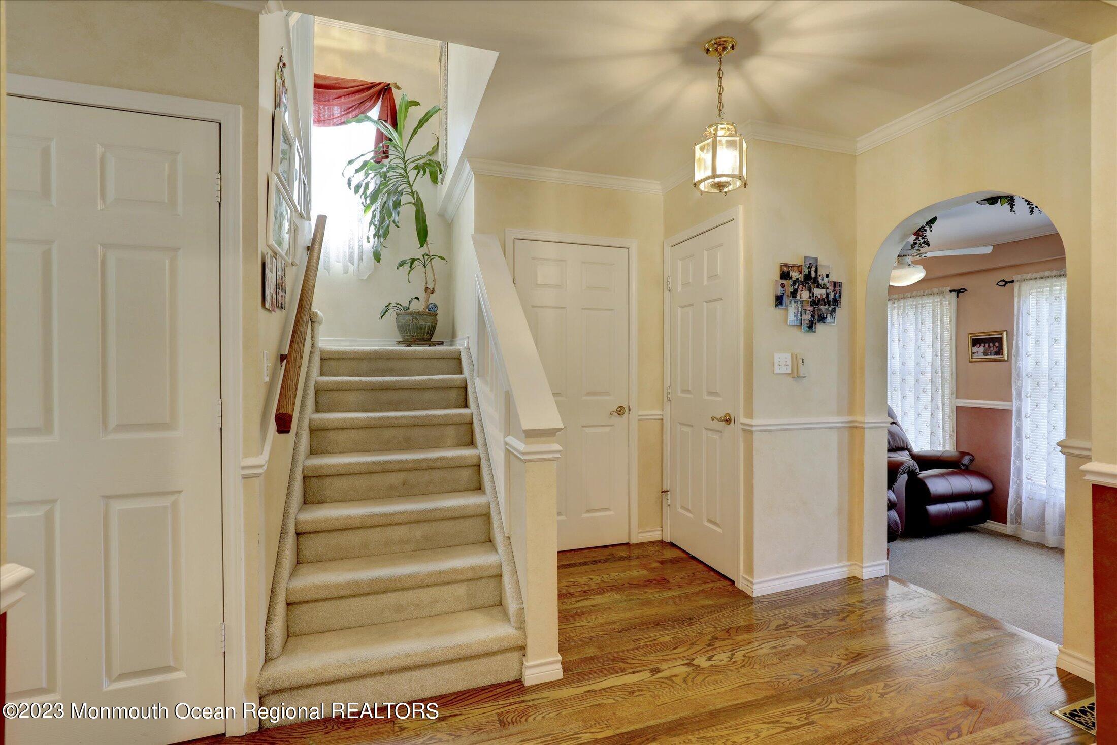 847 Waterworks Road Freehold, NJ 07728 - Photo 22 of 74 a view of a hallway view with wooden floor and staircase