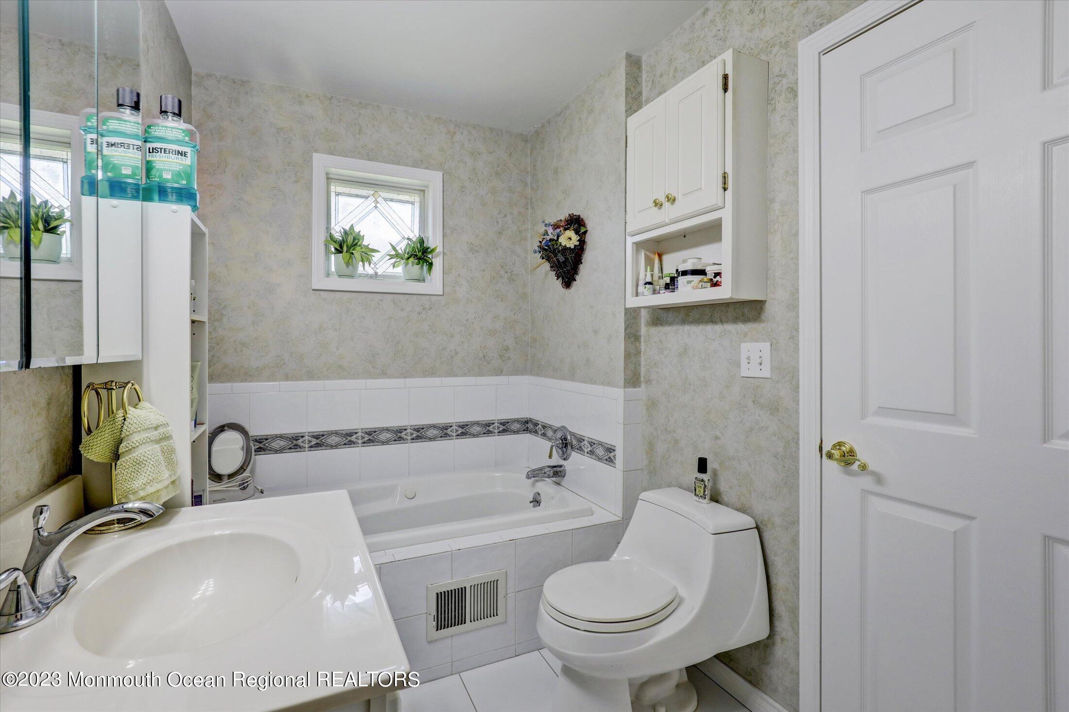 847 Waterworks Road Freehold, NJ 07728 - Photo 28 of 74 a bathroom with a sink and a toilet