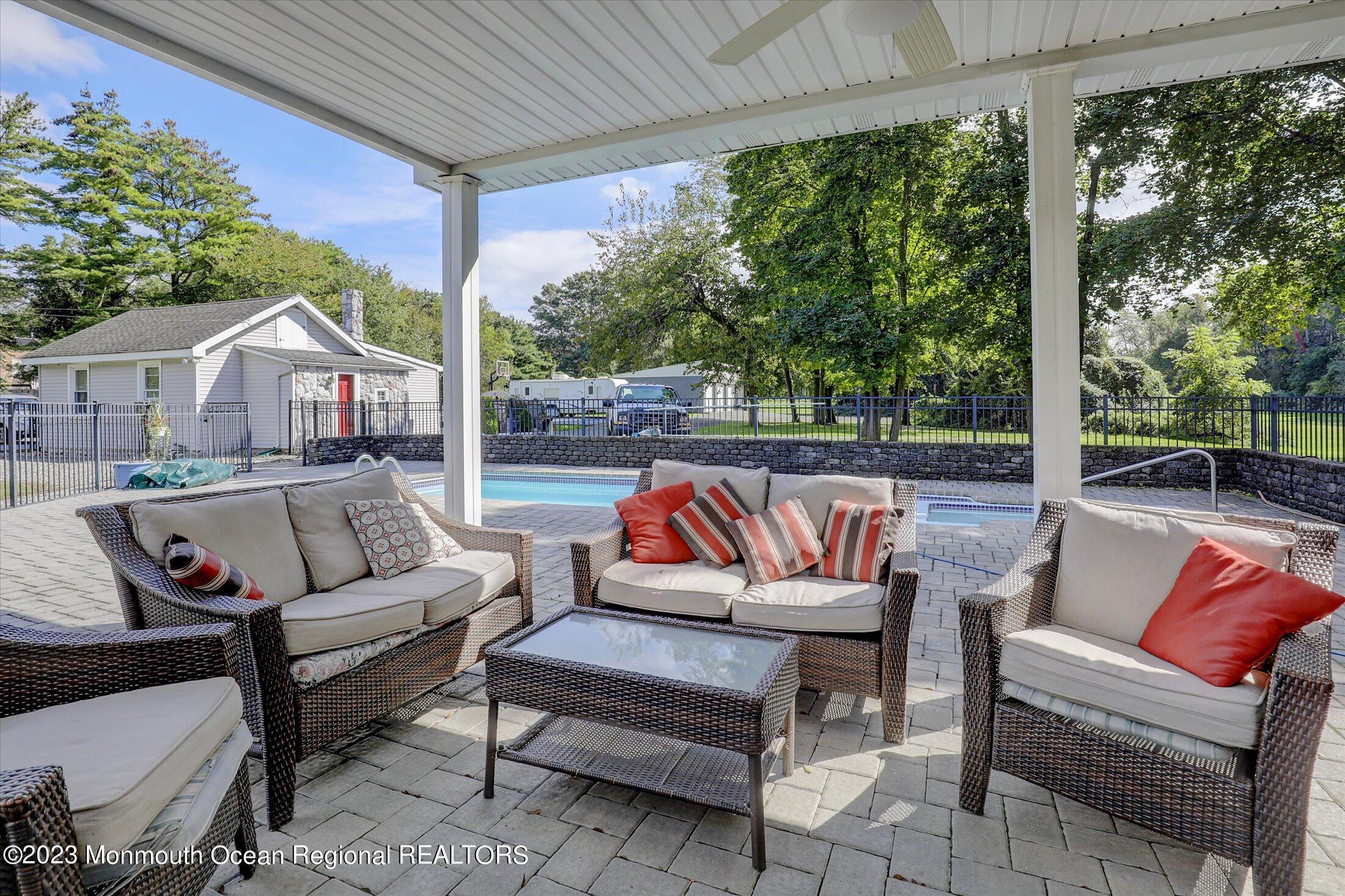 847 Waterworks Road Freehold, NJ 07728 - Photo 36 of 74 a outdoor living space with patio furniture and a potted plant