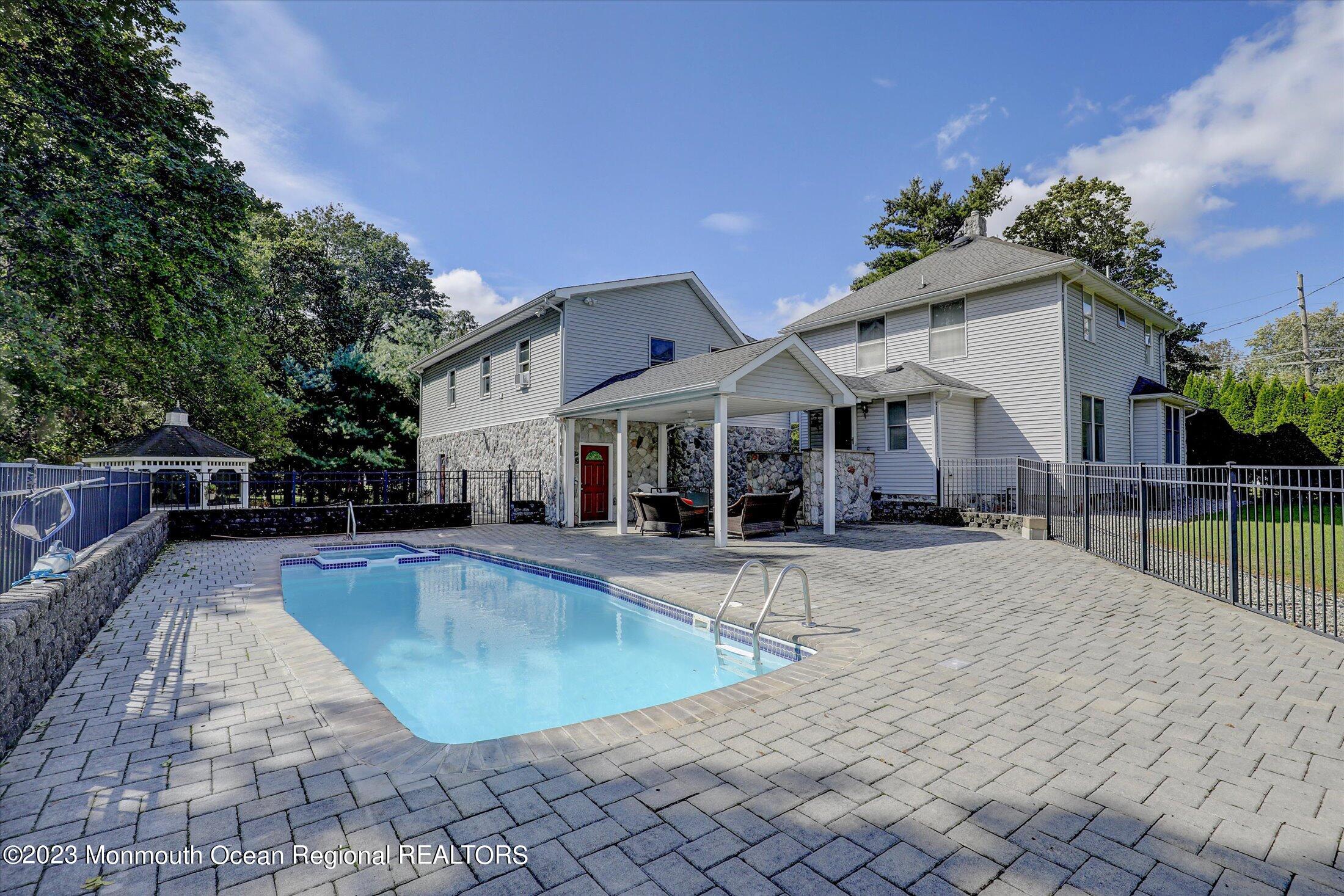 847 Waterworks Road Freehold, NJ 07728 - Photo 37 of 74 a view of a house with swimming pool