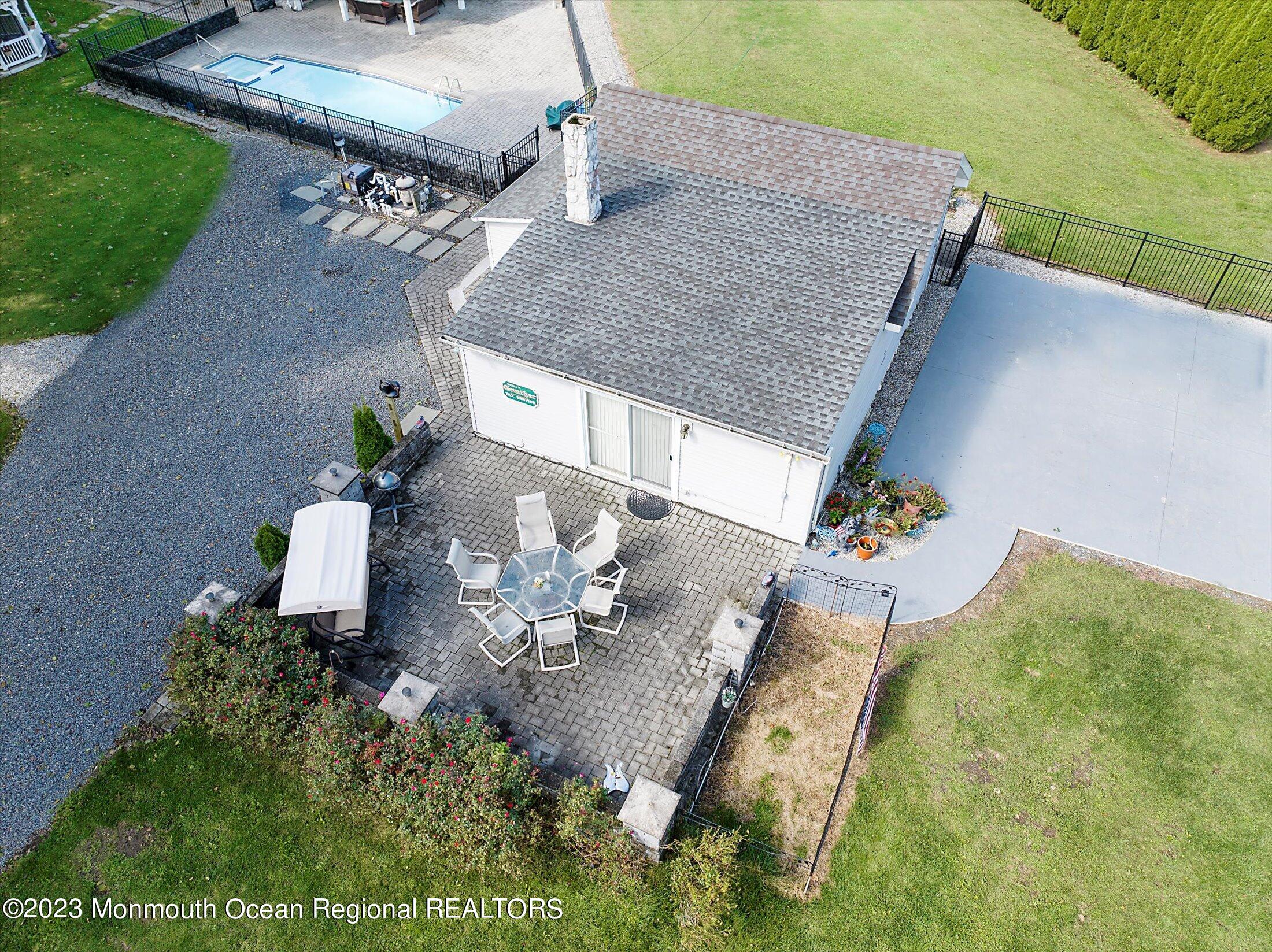 847 Waterworks Road Freehold, NJ 07728 - Photo 39 of 74 a terrace with dining table and chair
