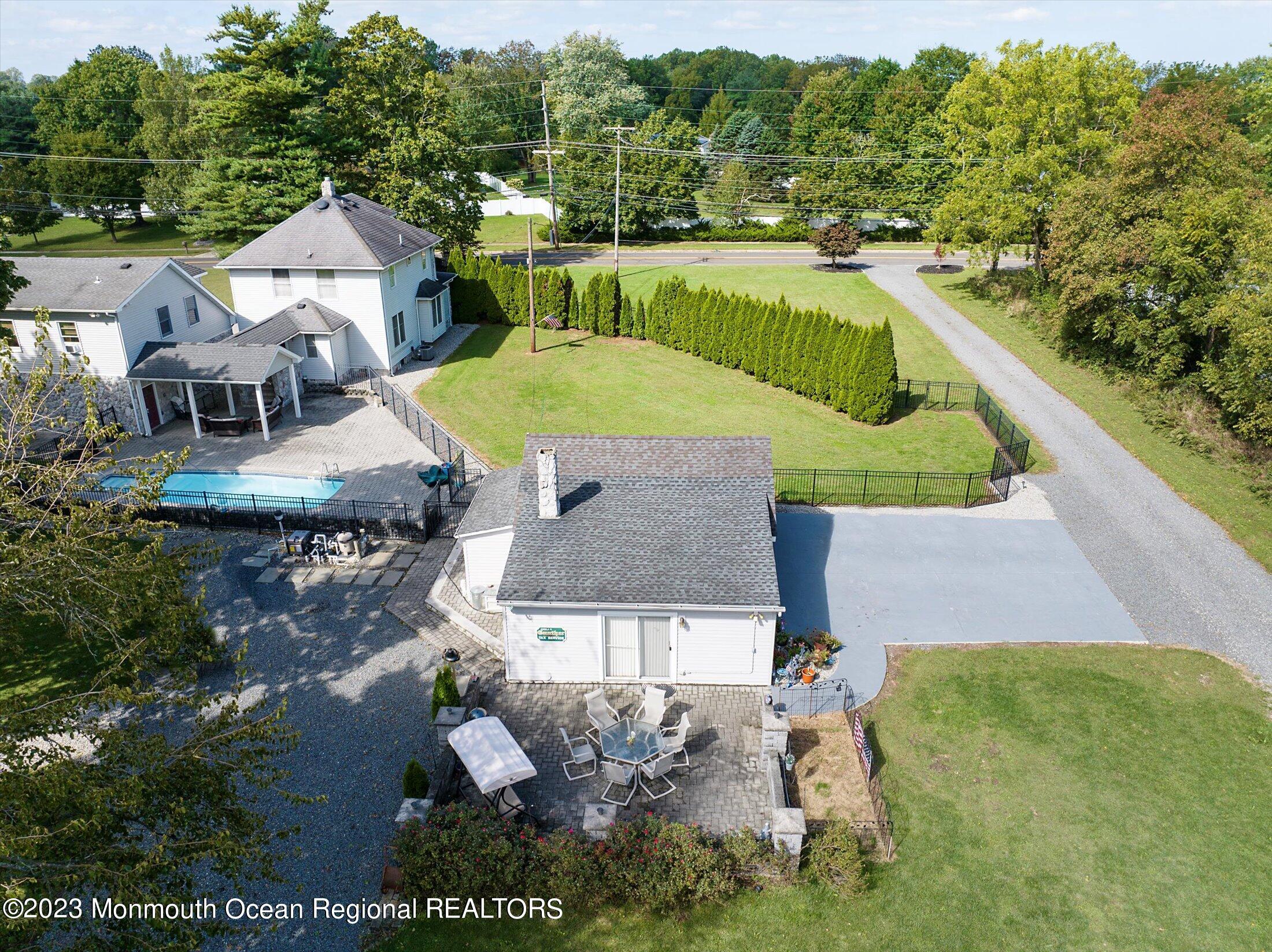 847 Waterworks Road Freehold, NJ 07728 - Photo 40 of 74 an aerial view of a house with outdoor space swimming pool and mountains