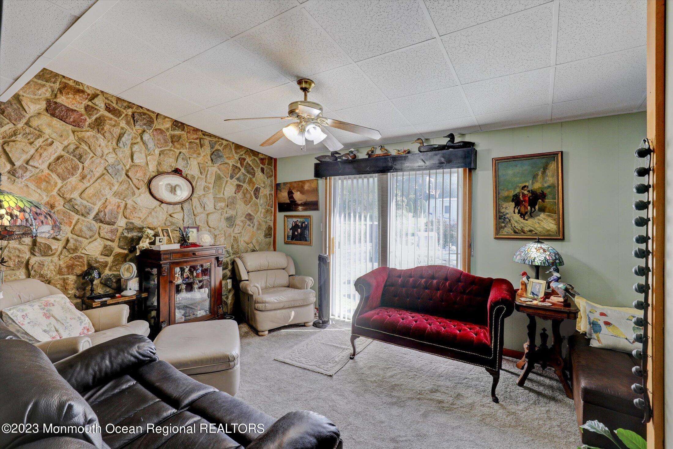 847 Waterworks Road Freehold, NJ 07728 - Photo 42 of 74 a living room with furniture and wooden floor