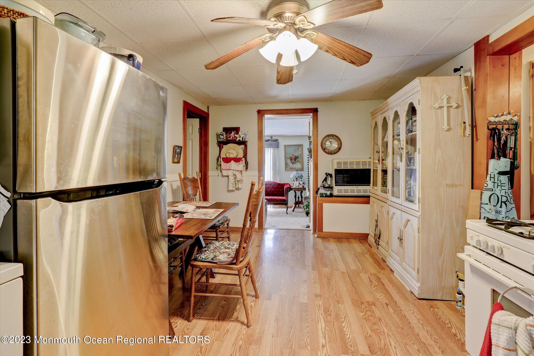 847 Waterworks Road Freehold, NJ 07728 - Photo 45 of 74 a living room with stainless steel appliances granite countertop furniture and a refrigerator