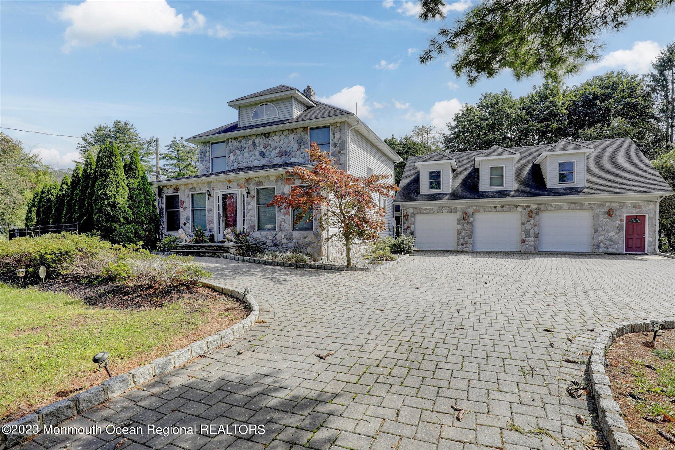 847 Waterworks Road Freehold, NJ 07728 - Photo 5 of 74 a front view of a house with a yard