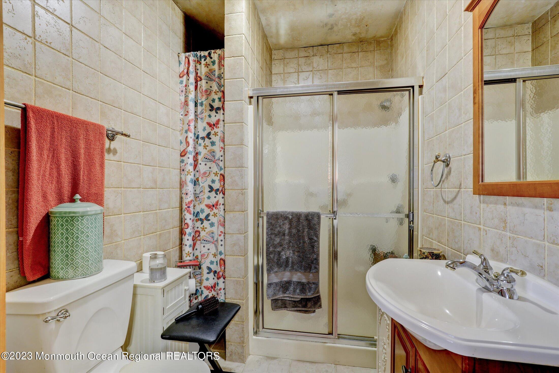 847 Waterworks Road Freehold, NJ 07728 - Photo 58 of 74 a bathroom with a sink toilet and shower