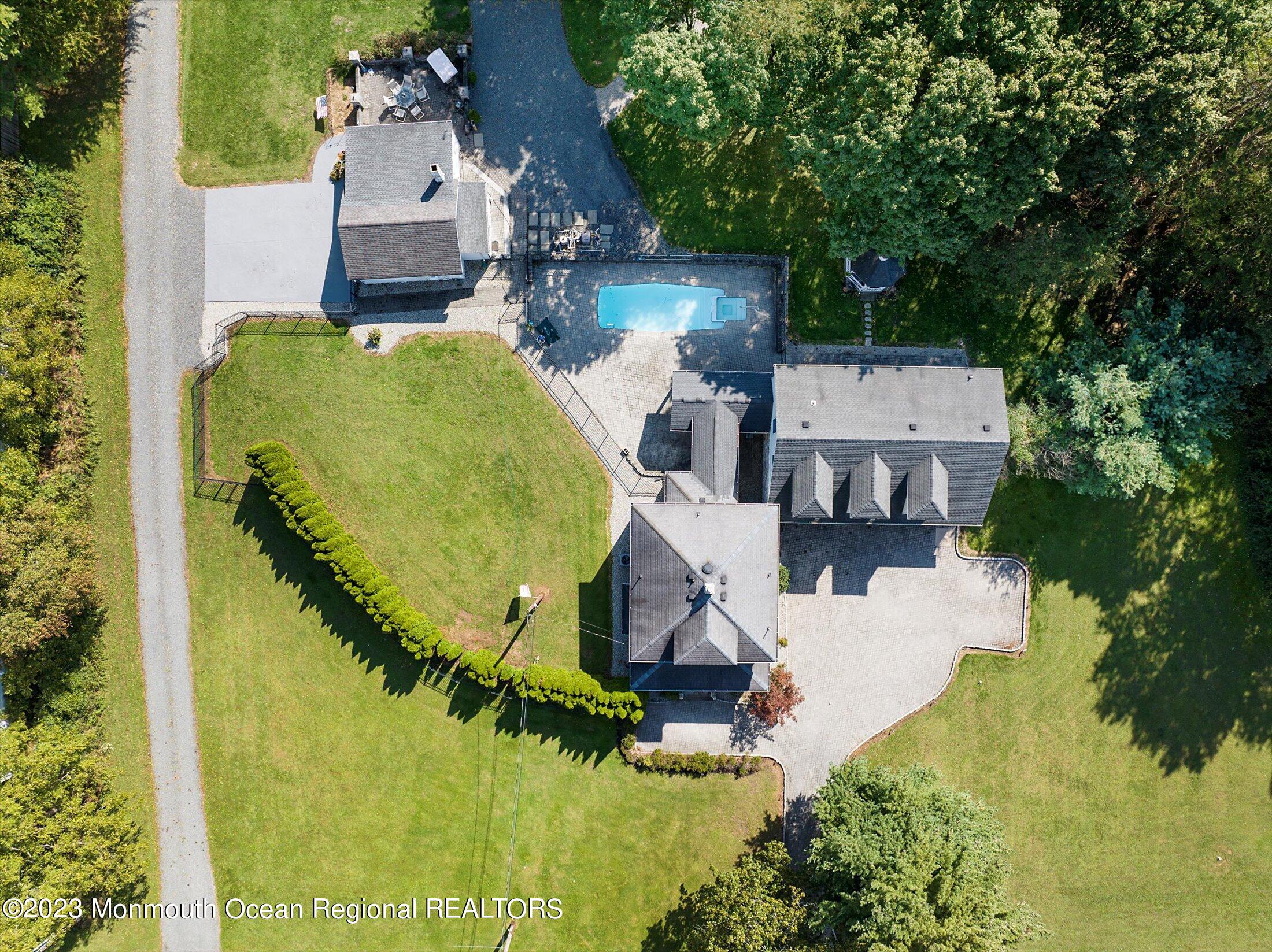 847 Waterworks Road Freehold, NJ 07728 - Photo 6 of 74 an aerial view of a house with outdoor space pool seating area and yard