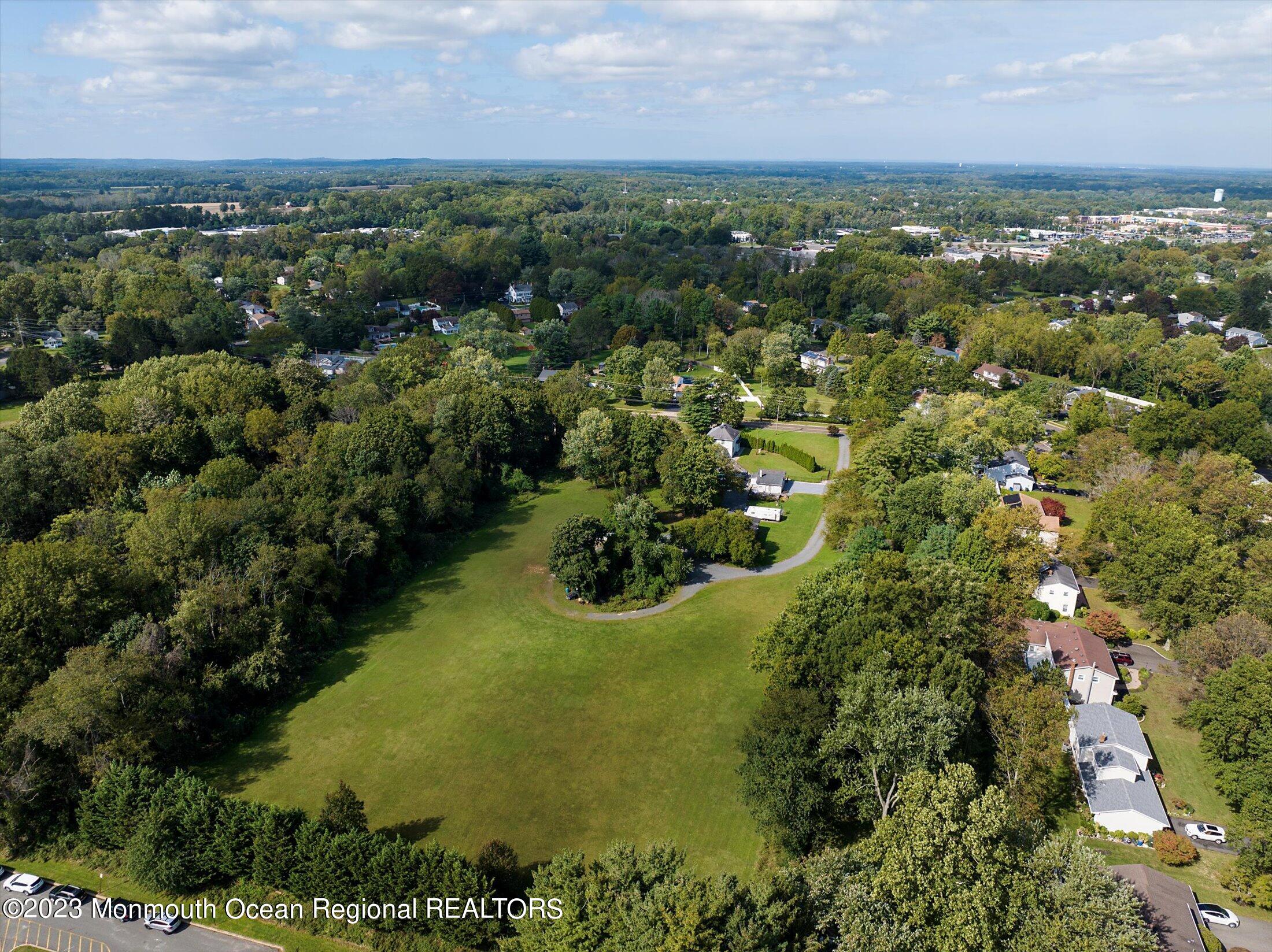 847 Waterworks Road Freehold, NJ 07728 - Photo 67 of 74 an aerial view of residential houses with outdoor space and trees