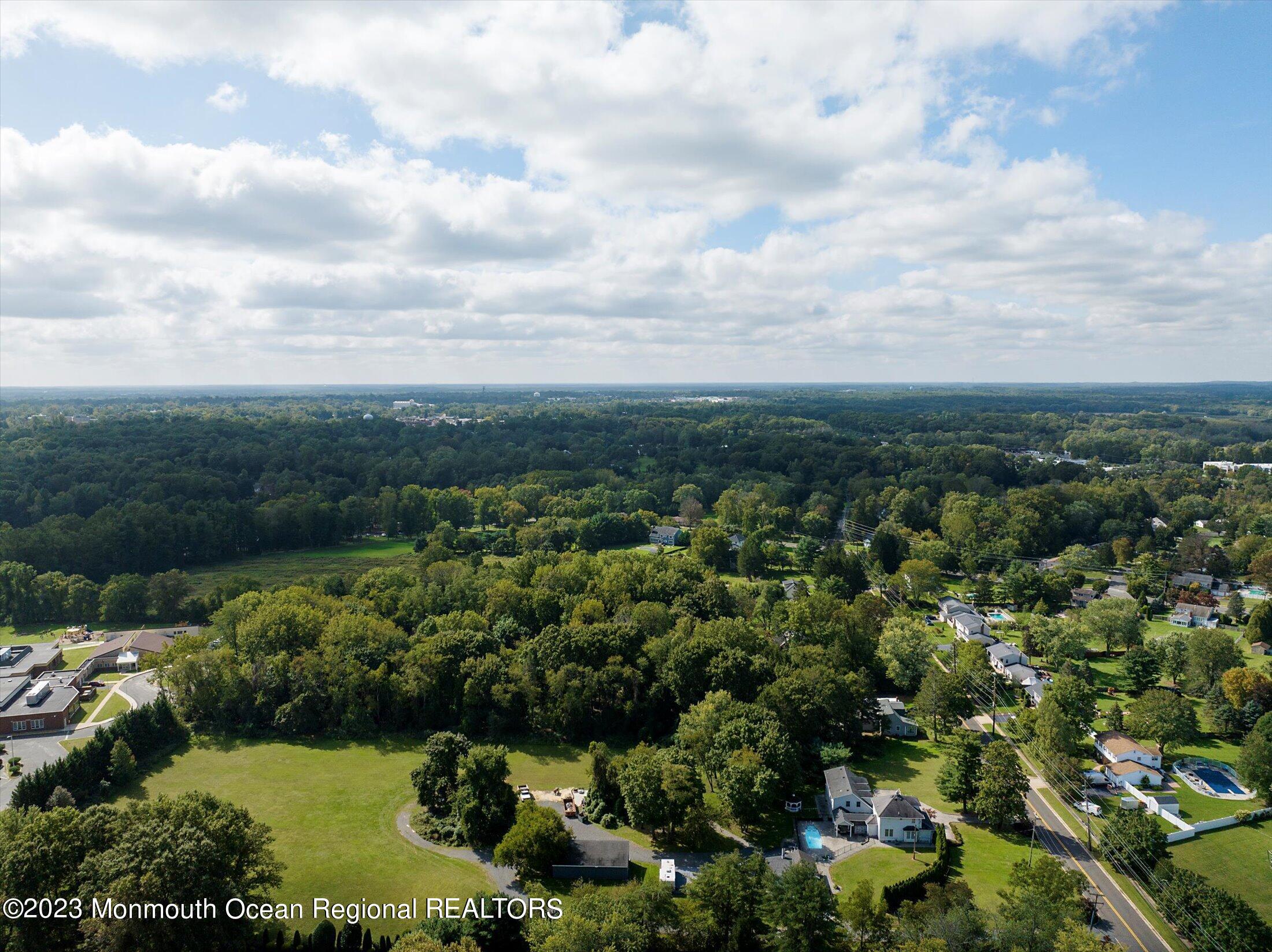 847 Waterworks Road Freehold, NJ 07728 - Photo 68 of 74 an aerial view of residential house with outdoor space and trees all around