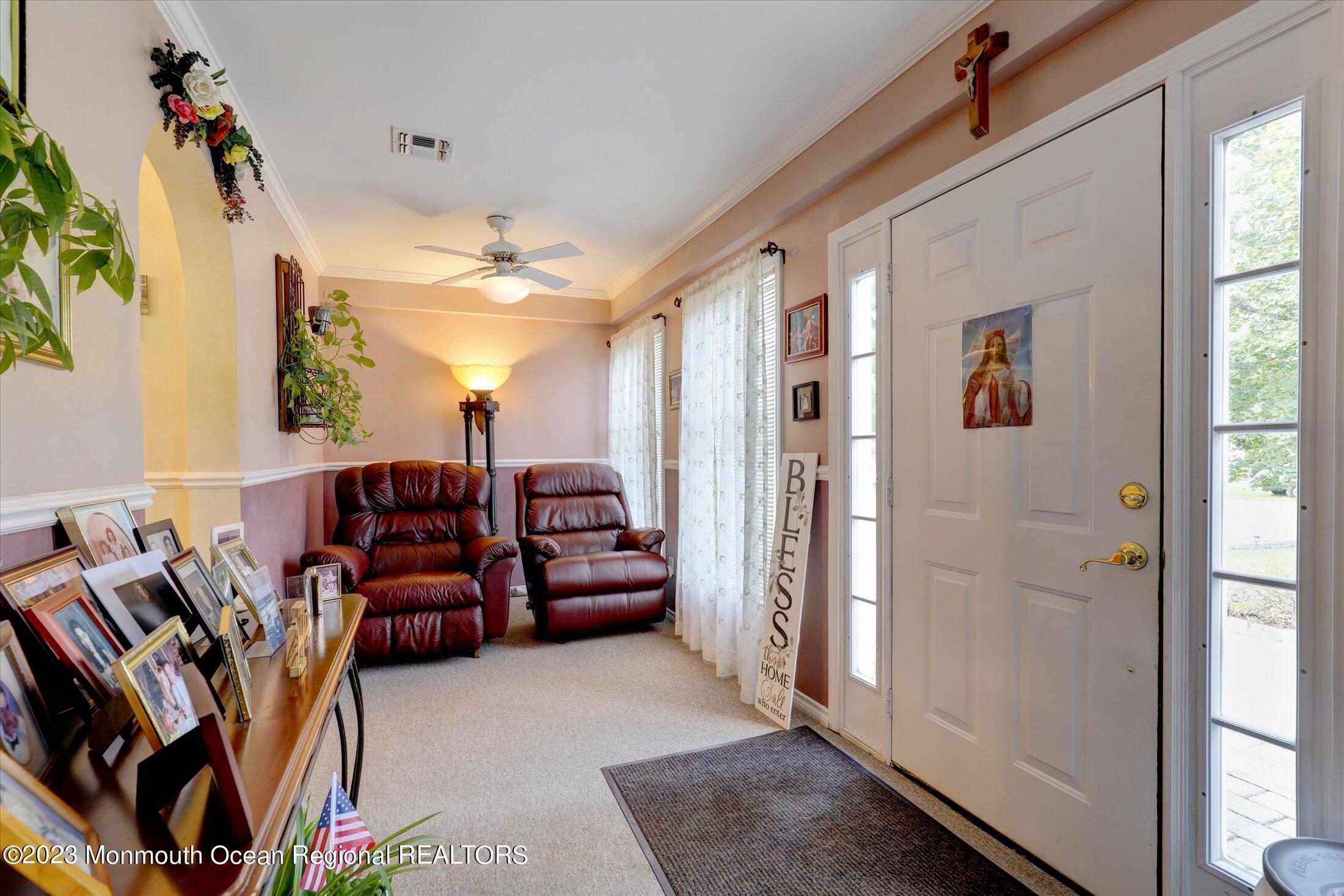 847 Waterworks Road Freehold, NJ 07728 - Photo 7 of 74 a living room with furniture a lamp and a window