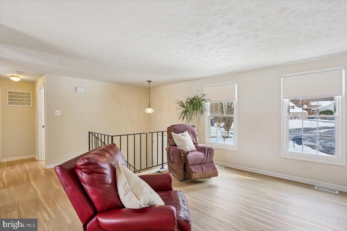 18112 Kodella Court Gaithersburg, MD 20877 - Photo 11 of 60 a living room with furniture and windows