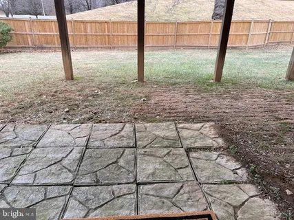 a view of a house with a snow in a yard