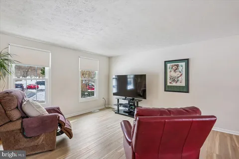a living room with furniture and windows