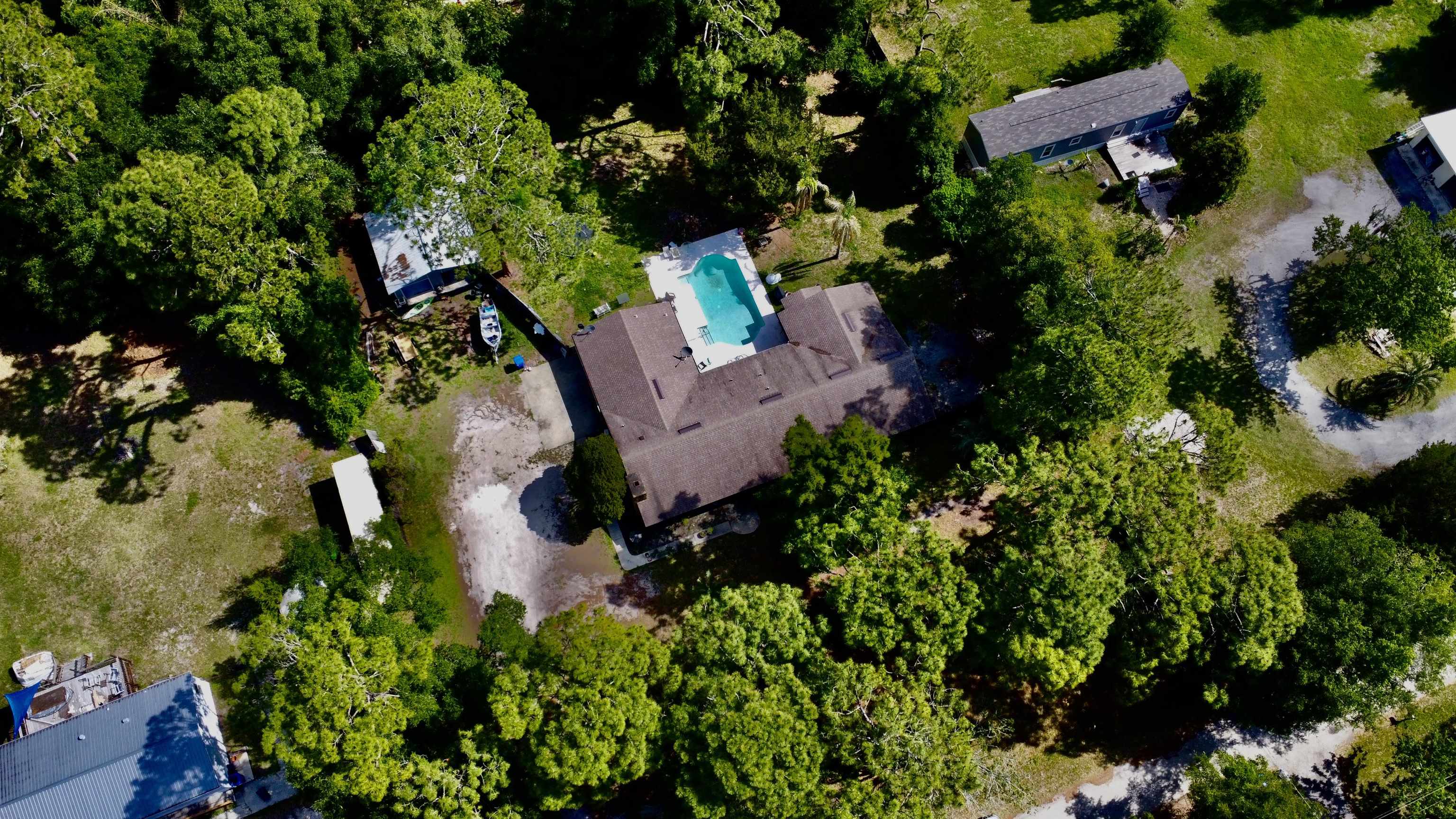 554 Hayley Road St. Augustine, FL 32086 - Photo 46 of 46 an aerial view of a house with a yard and garden