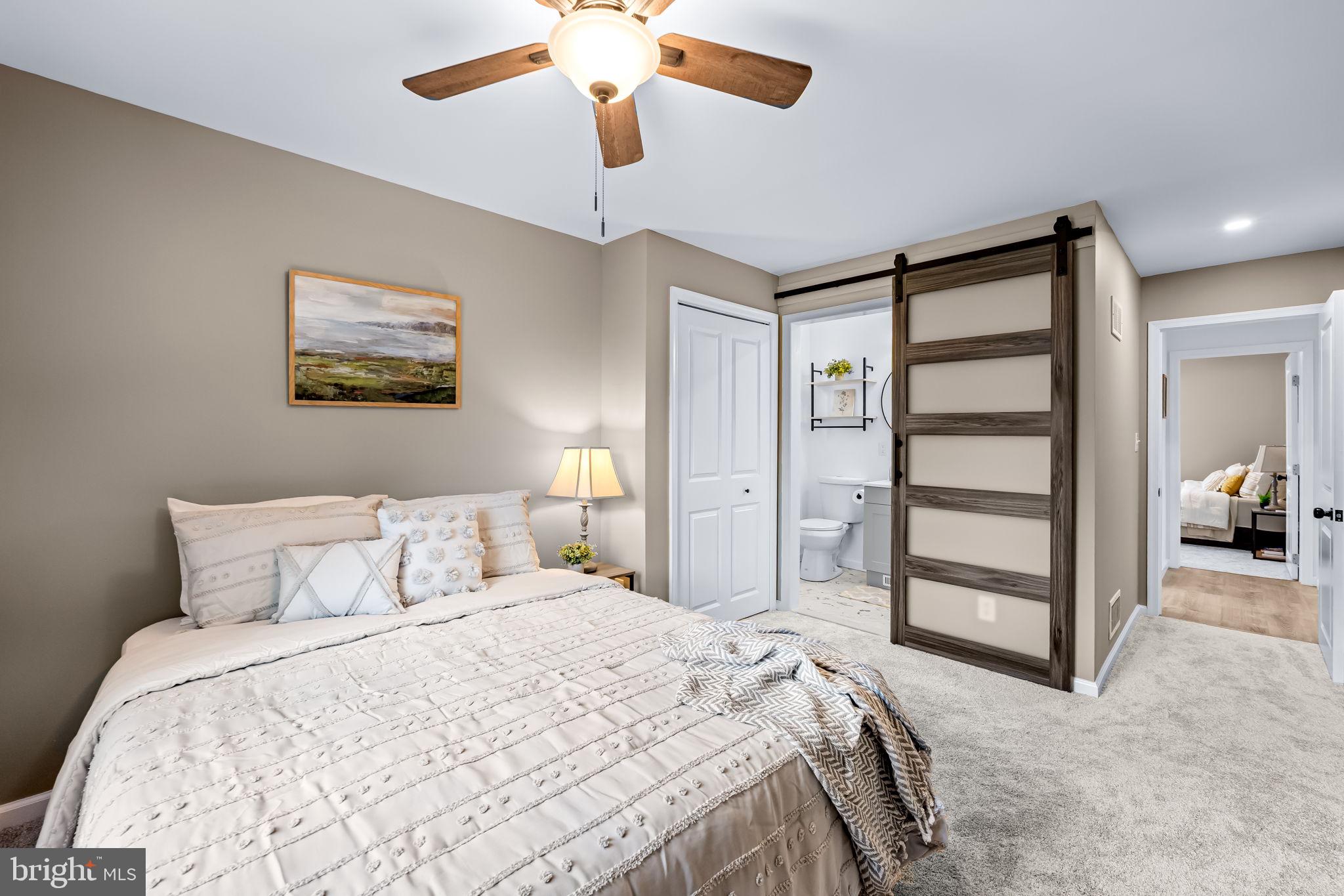 628 North Stuart Street Baltimore, MD 21221 - Photo 15 of 39 a bedroom with a bed and a view of closet