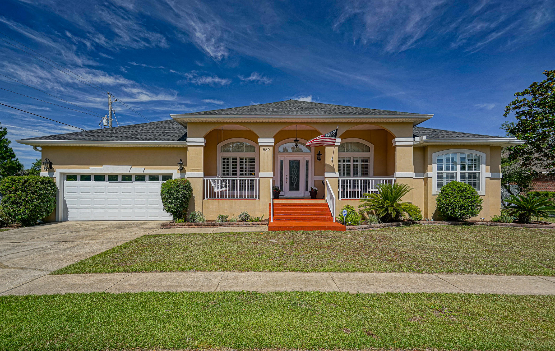 569 Radiant Circle Mary Esther, FL 32569 - Photo 1 of 42 a front view of a house with a yard