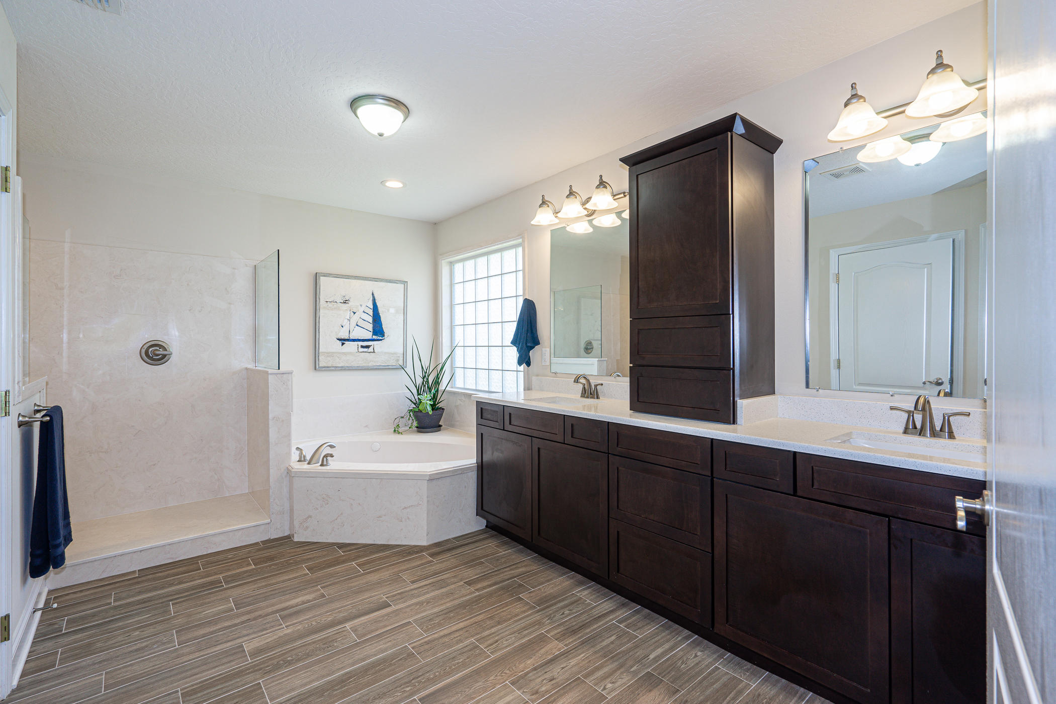 569 Radiant Circle Mary Esther, FL 32569 - Photo 11 of 42 a bathroom with a sink double vanity granite tub shower and a mirror