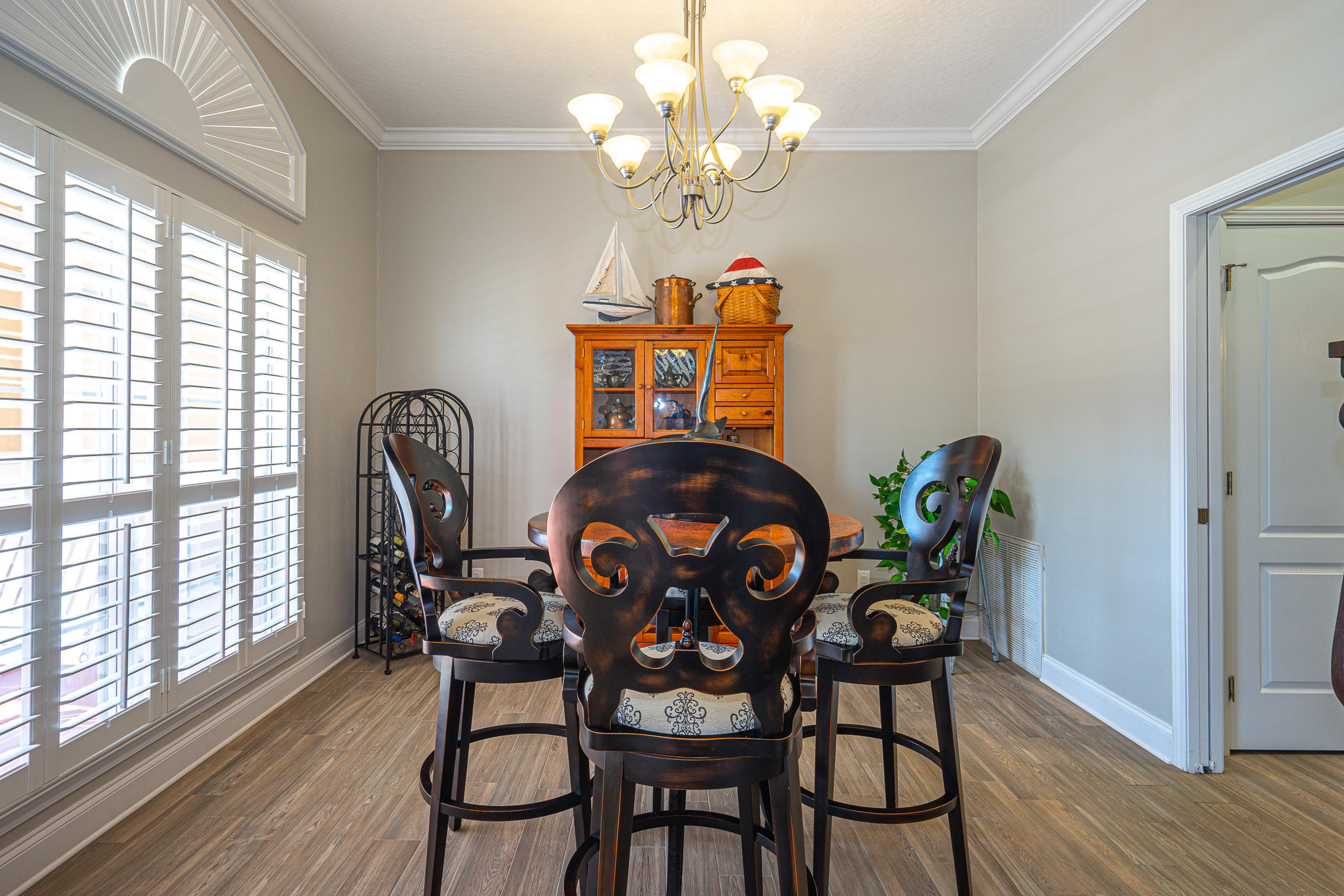 569 Radiant Circle Mary Esther, FL 32569 - Photo 13 of 42 a dining room with furniture potted plants and wooden floor