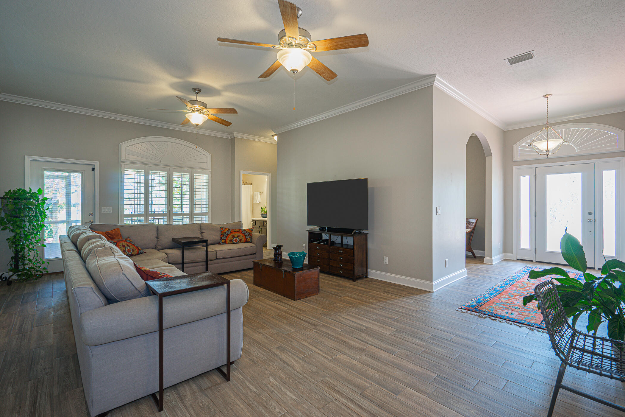 569 Radiant Circle Mary Esther, FL 32569 - Photo 14 of 42 a living room with furniture and a flat screen tv