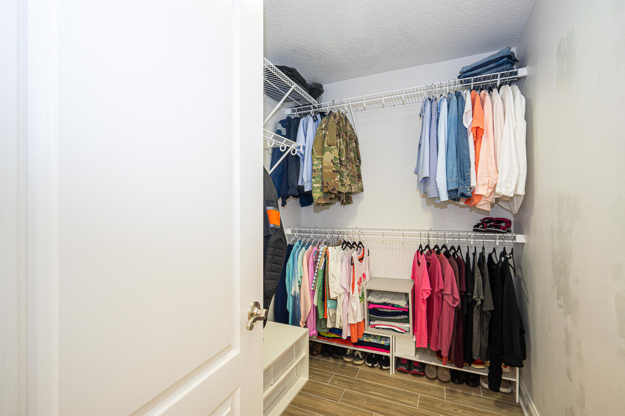 569 Radiant Circle Mary Esther, FL 32569 - Photo 18 of 42 a view of walk in closet with clothes and shoes