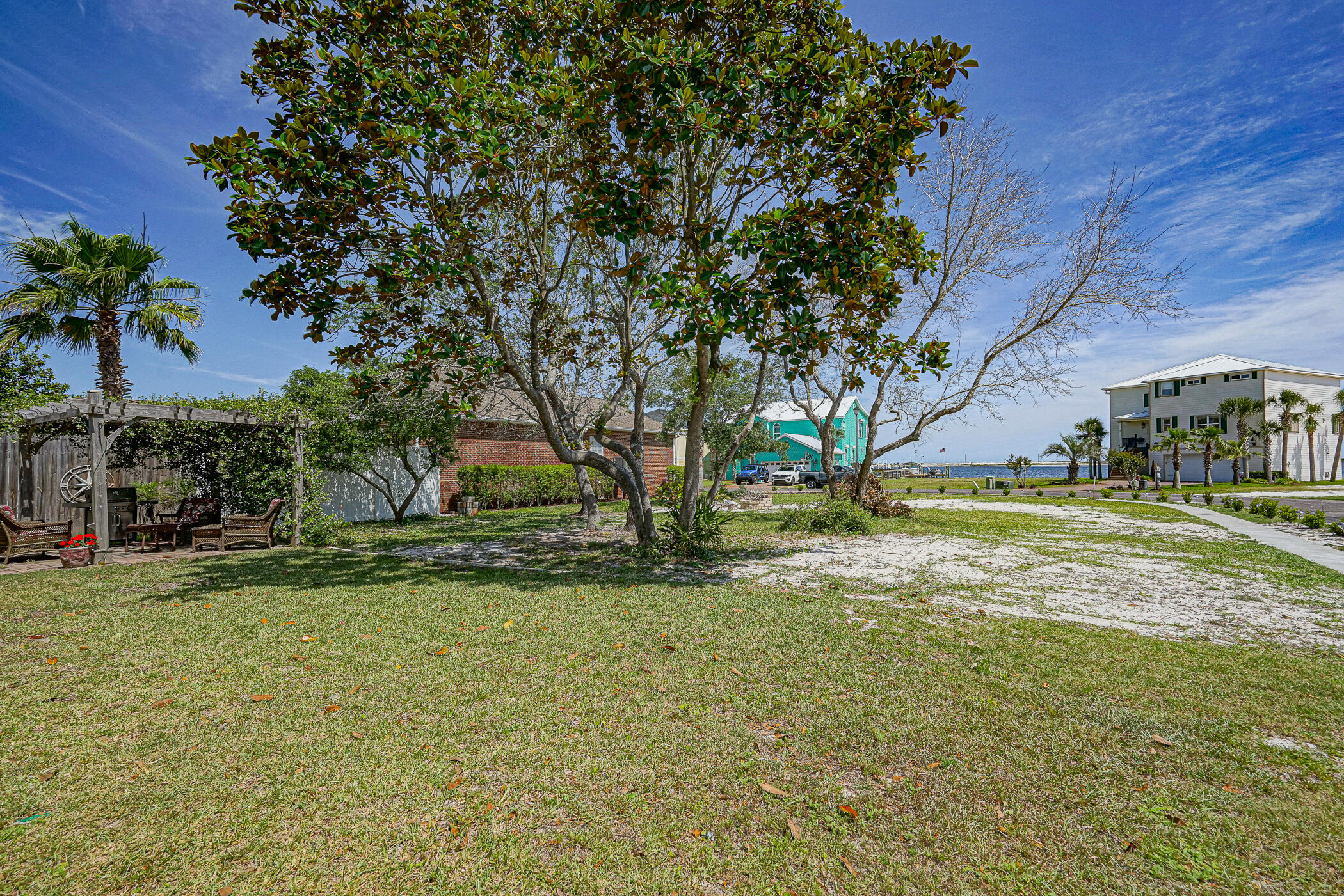 569 Radiant Circle Mary Esther, FL 32569 - Photo 19 of 42 a view of a yard with yellow house