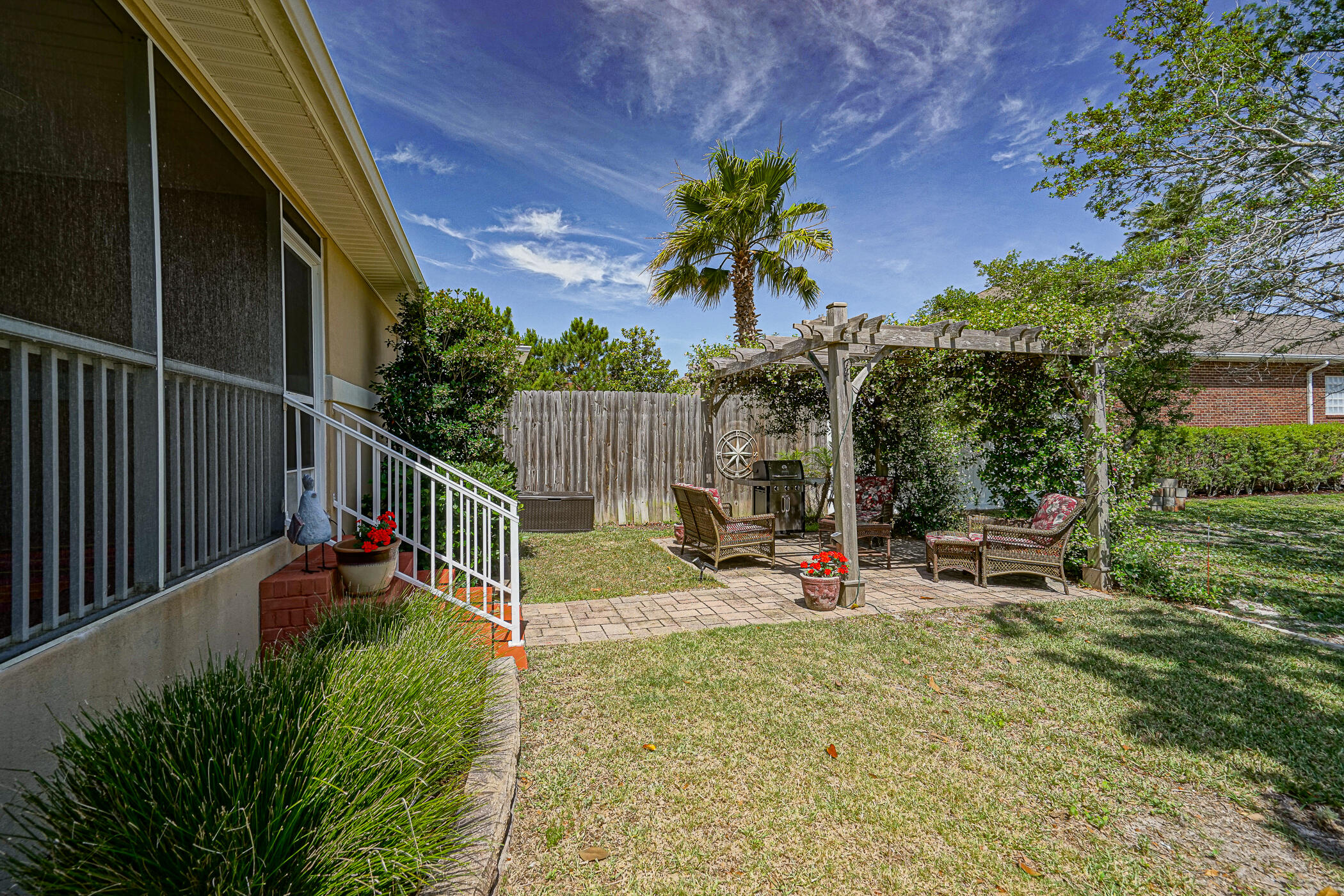 569 Radiant Circle Mary Esther, FL 32569 - Photo 20 of 42 a view of a bench in patio with wooden fence