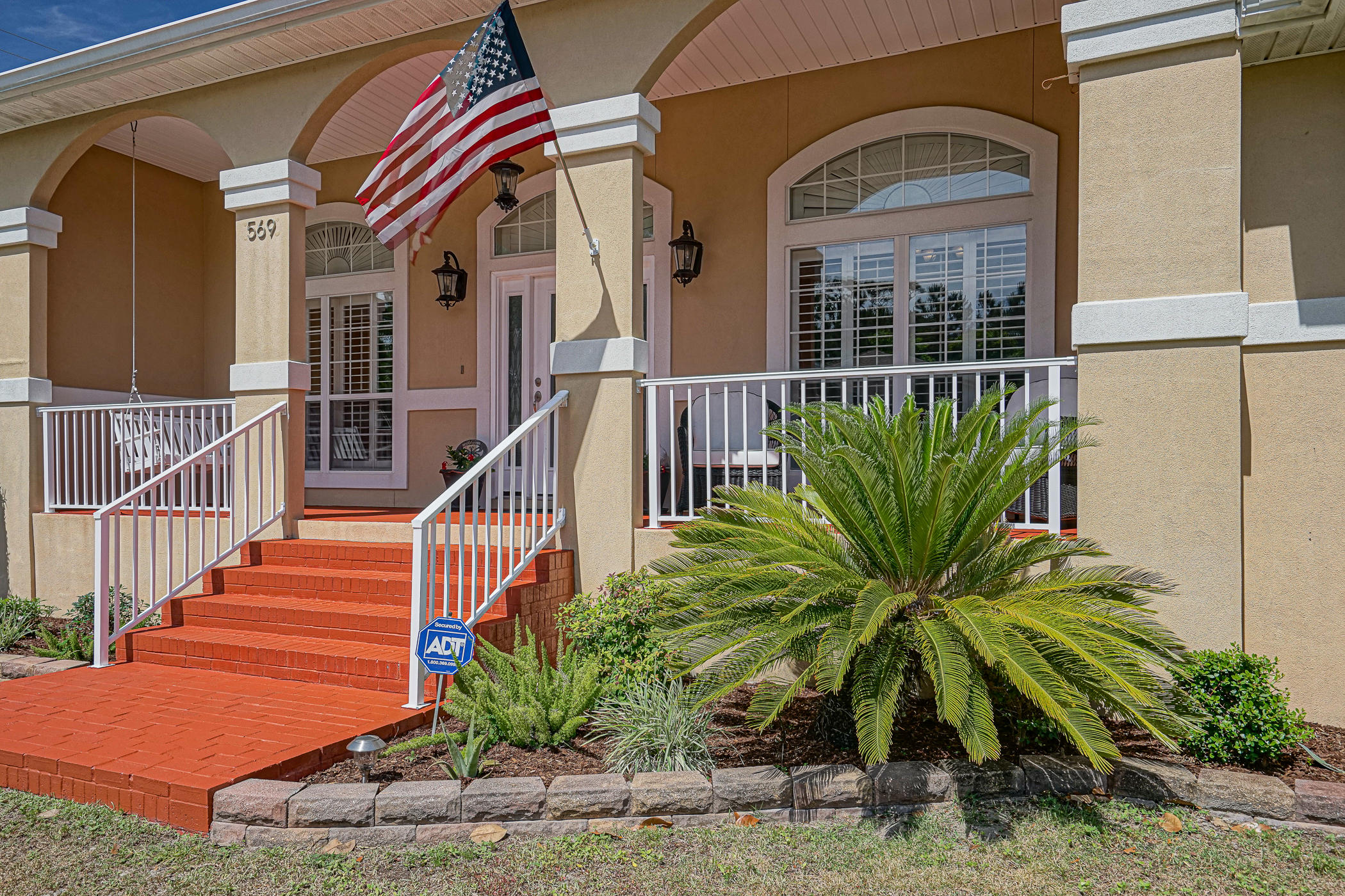 569 Radiant Circle Mary Esther, FL 32569 - Photo 2 of 42 a view of front door and small plants