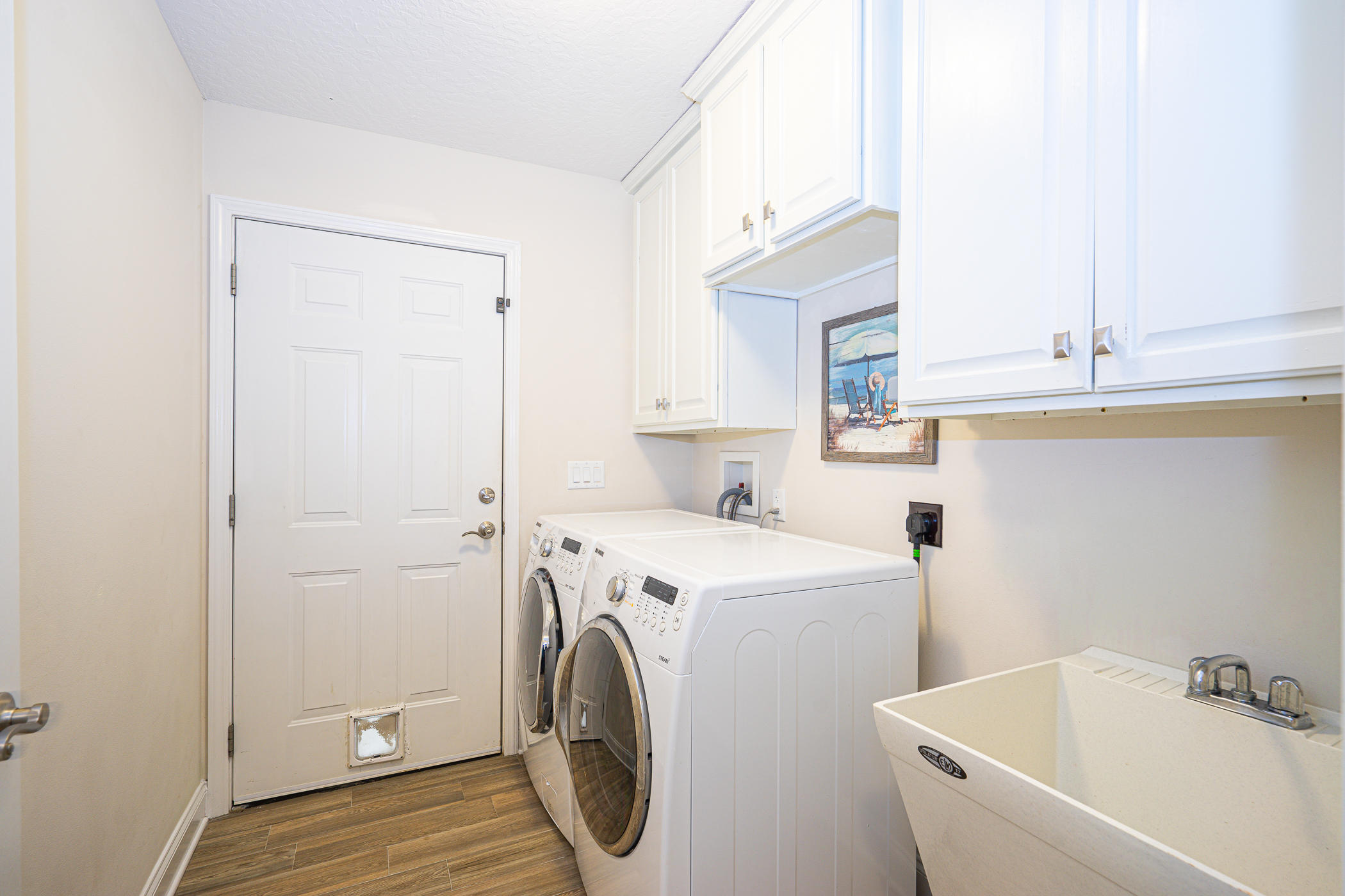 569 Radiant Circle Mary Esther, FL 32569 - Photo 22 of 42 a utility room with dryer and washer