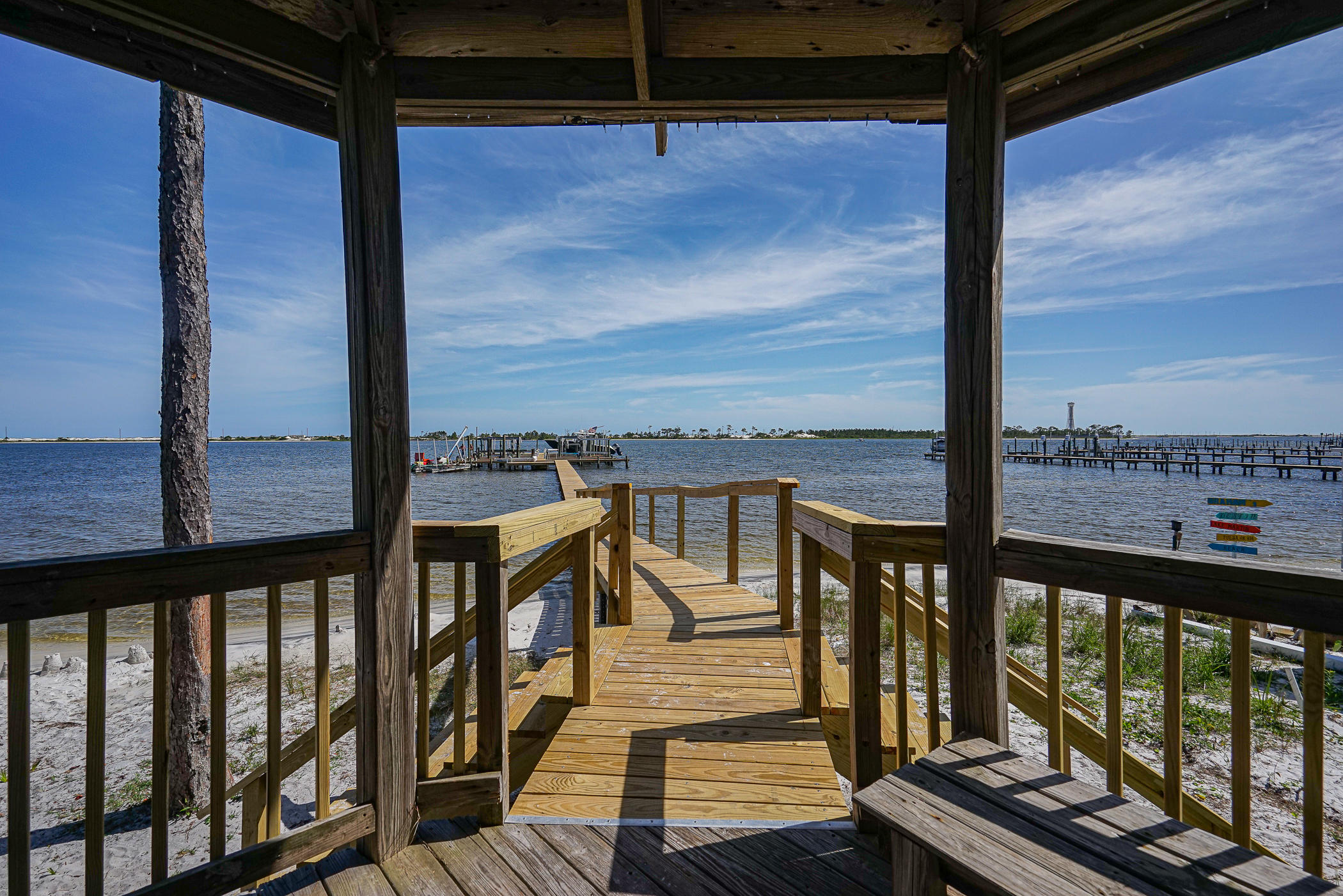 569 Radiant Circle Mary Esther, FL 32569 - Photo 25 of 42 a view of a balcony with wooden chairs