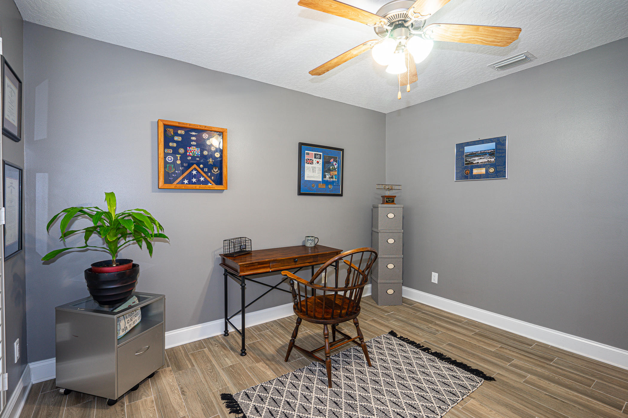 569 Radiant Circle Mary Esther, FL 32569 - Photo 31 of 42 a workspace with furniture and a potted plant