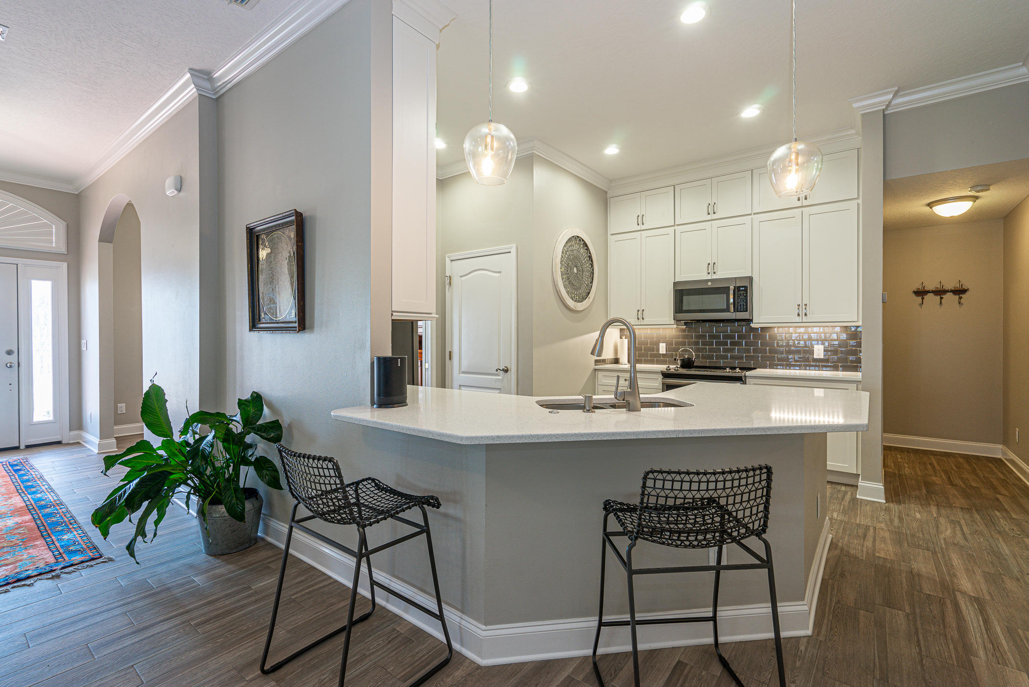 569 Radiant Circle Mary Esther, FL 32569 - Photo 35 of 42 a kitchen with sink and center island with wooden floor